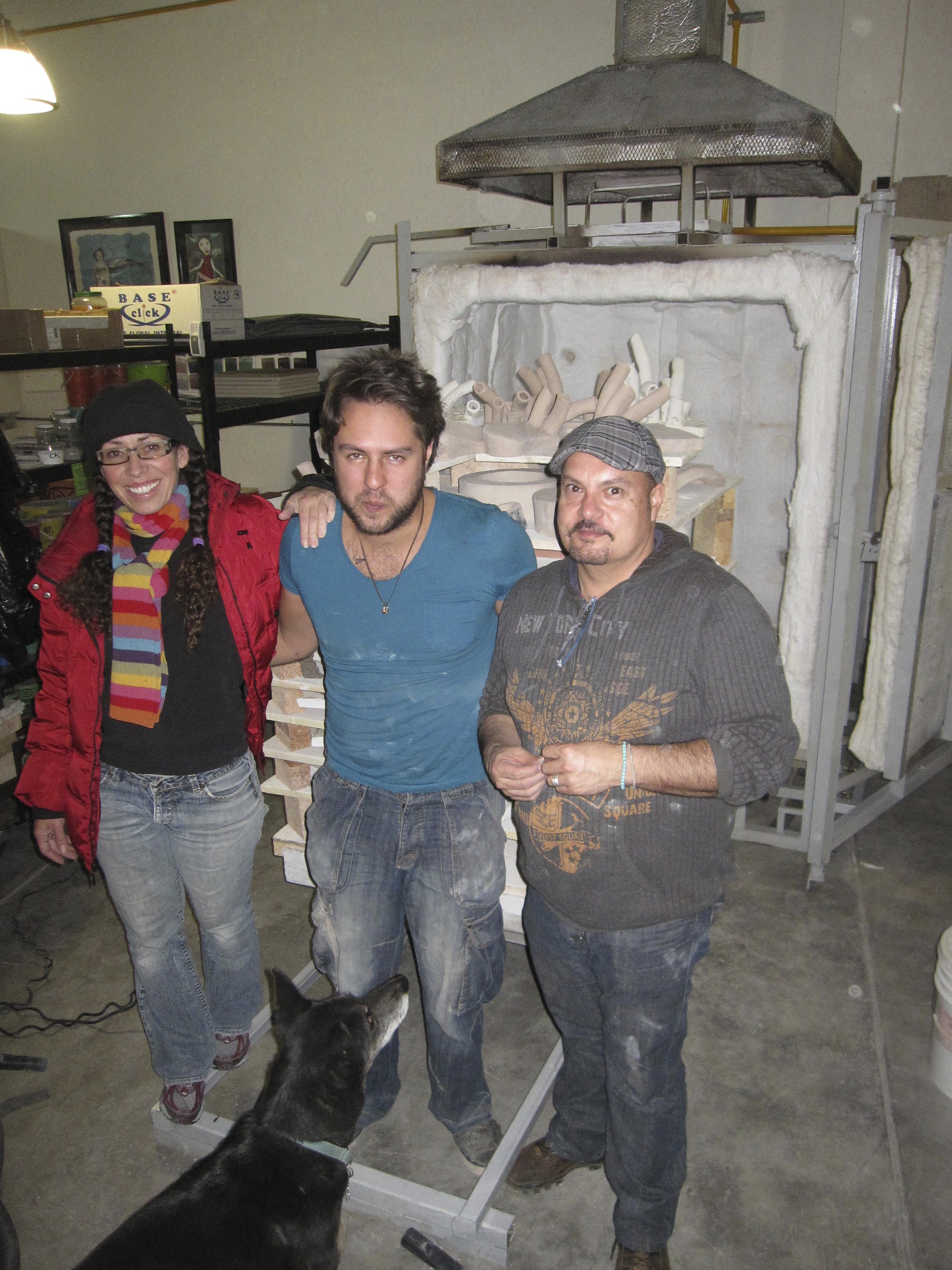 Adria, Federico and Marco Vargas loading the kiln