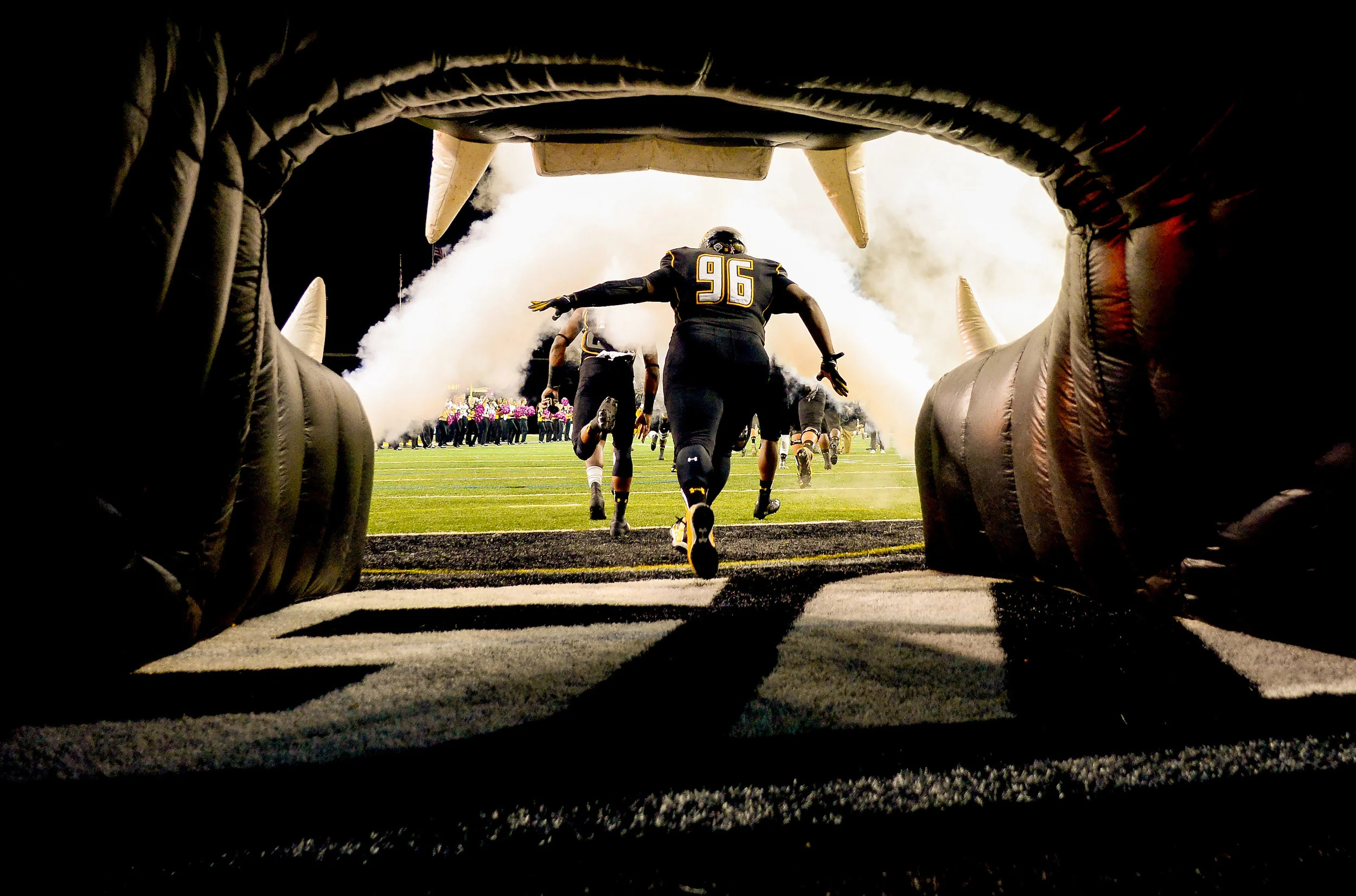 Towson University defensive tackle Arnold Farmer runs onto the field
during a home game against Villanova University on Oct. 12, 2013 in Baltimore, Md.