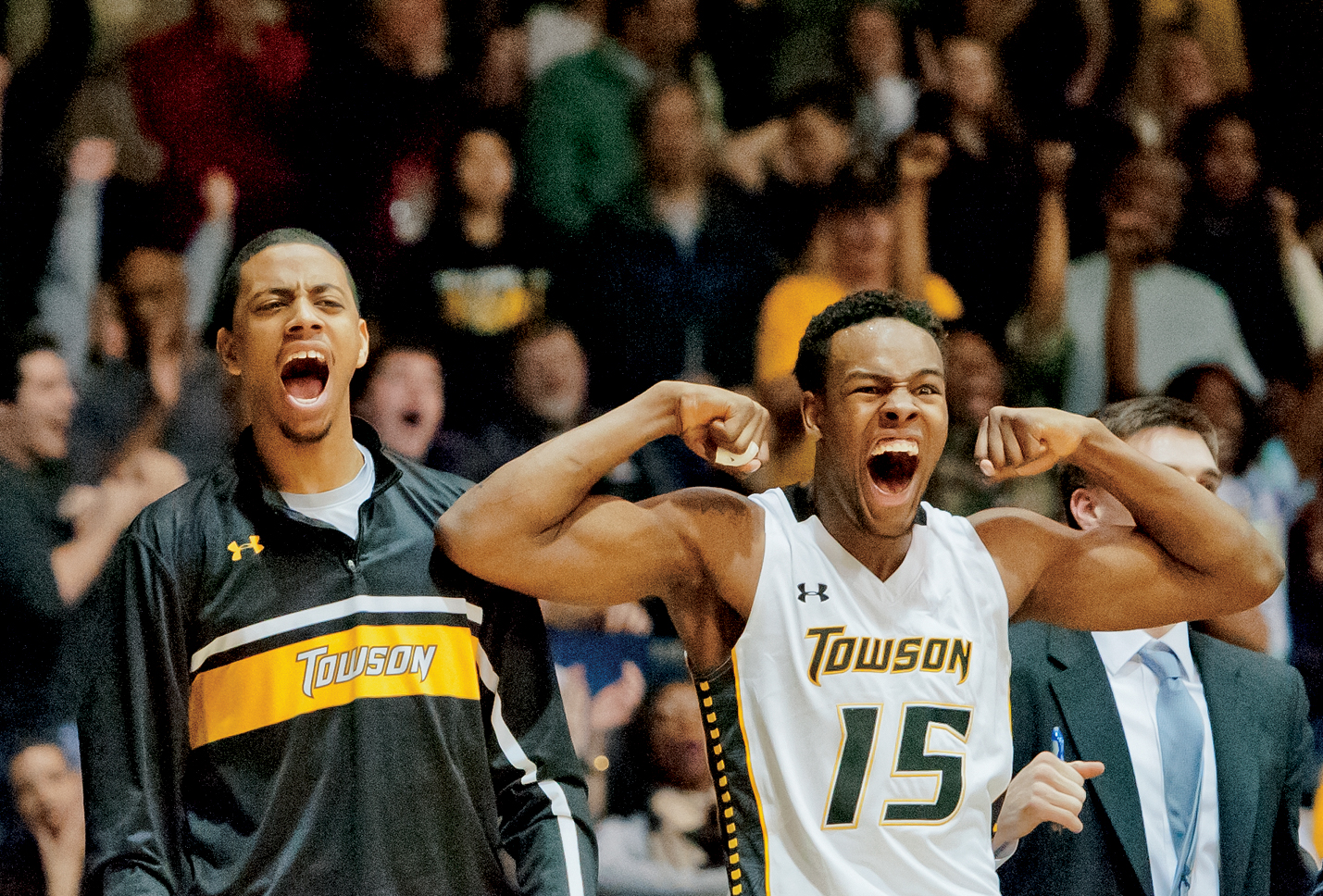 Towson University men's basketball players Jamel Flash and Timajh Parker-Rivera cheer as they win their final game against Hofstra University on March 2, 2013 in Baltimore, Md. This game broke the NCAA record for biggest turn around from a previous season.