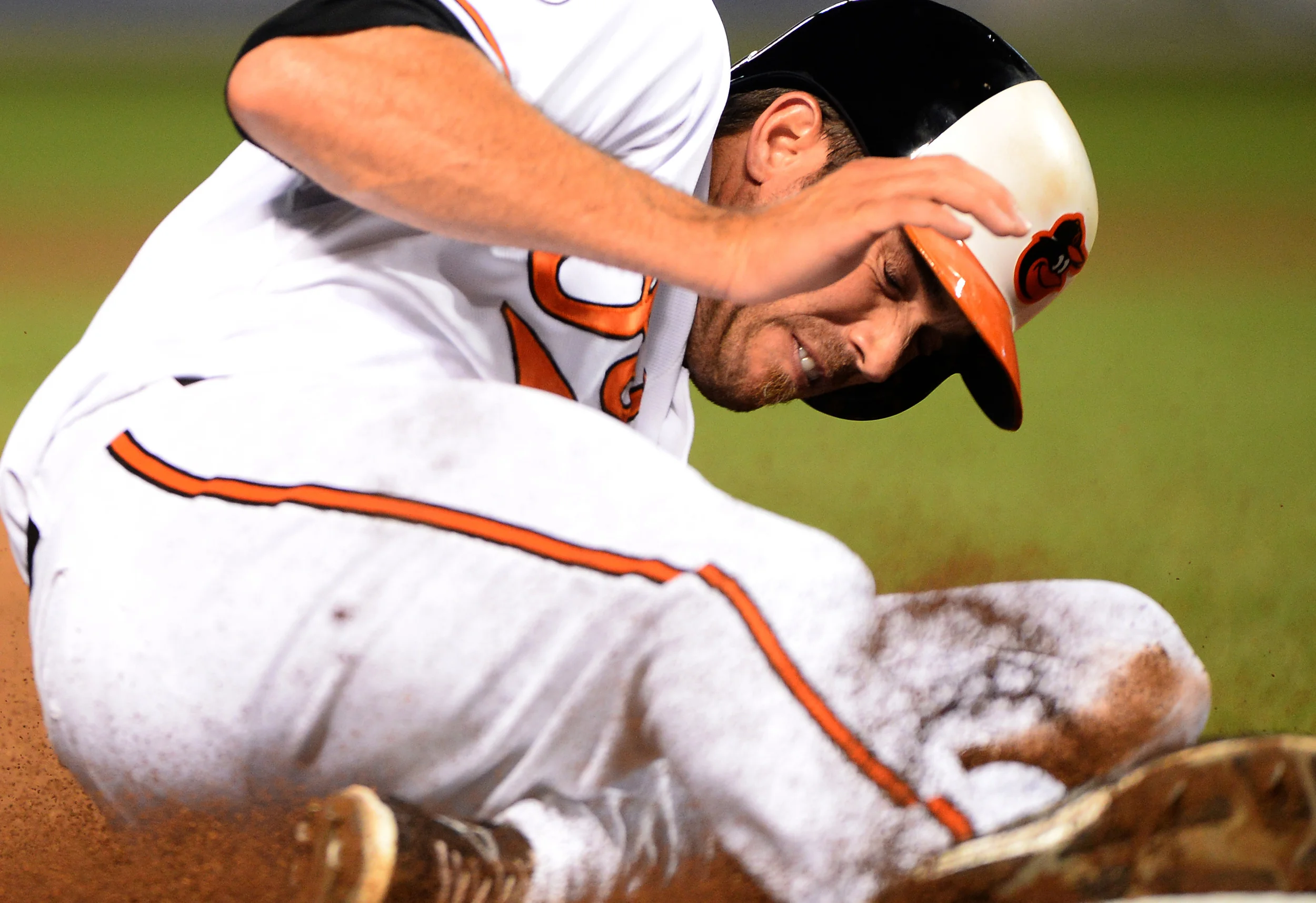 Baltimore Orioles shortstop J.J. Hardy slides into third base during a
home game against the New York Yankees on Sept. 9, 2013 in Baltimore,
Md.