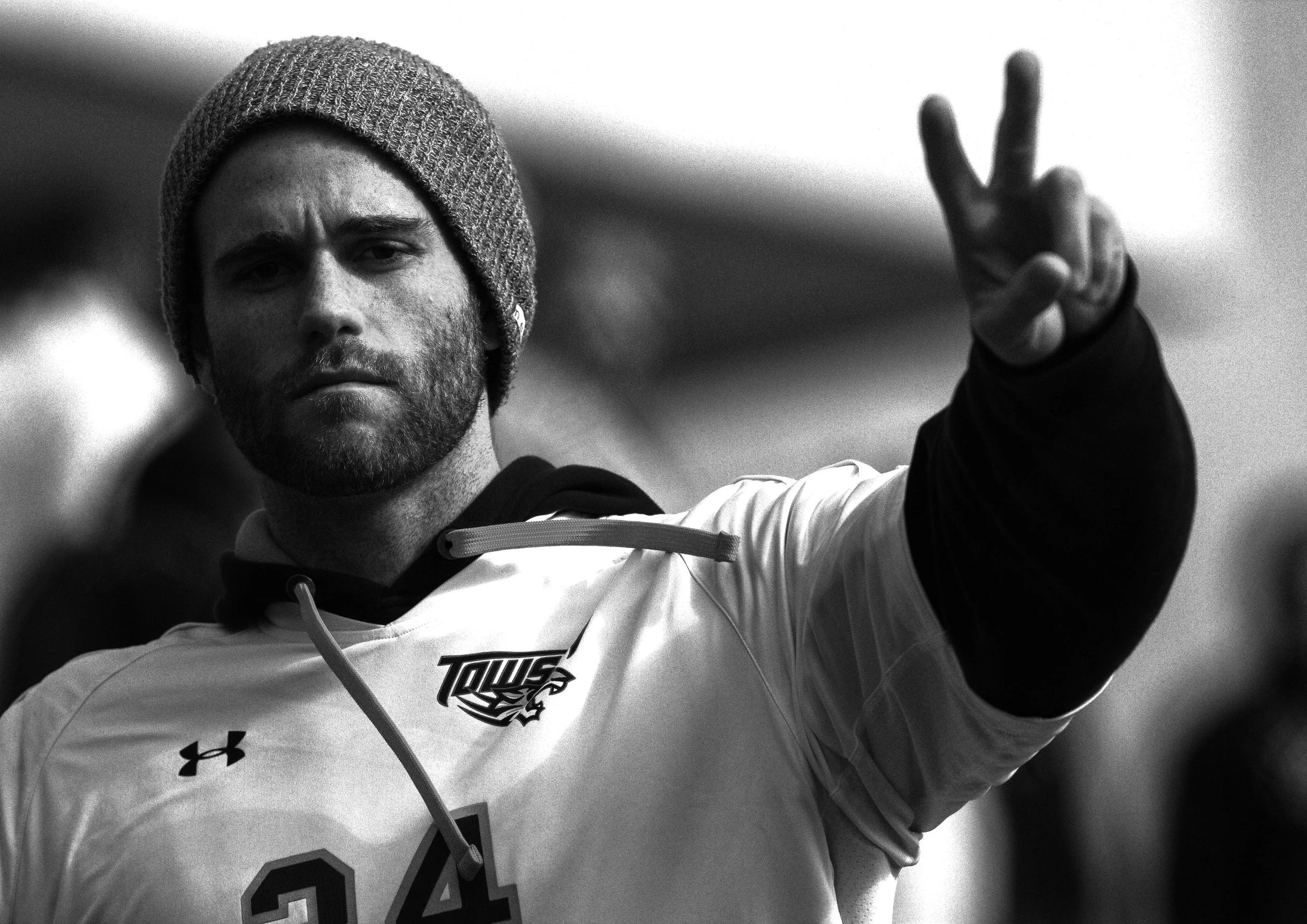 Towson University men's soccer player Cameron Kidwell attends a Towson University baseball game on March 8, 2013 to show his support for the team. Men's soccer also received word that their program will no longer be supported for the next season.