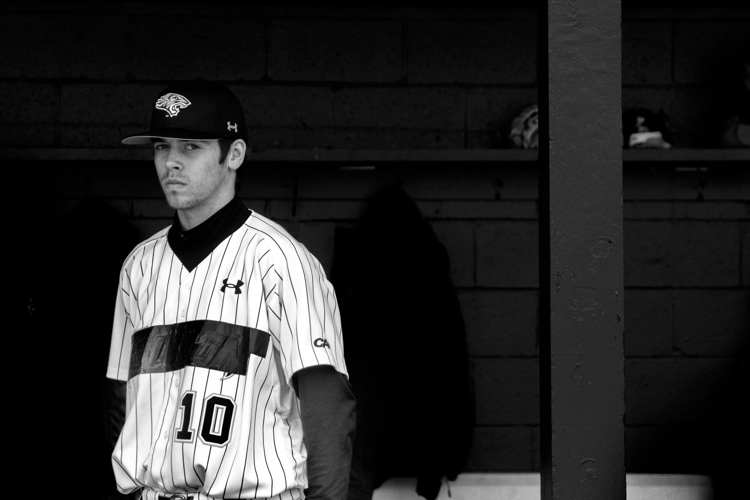 Towson University pitcher David Sapp makes eye contact with media members during a home game on March 8, 2013 in Baltimore, Md.