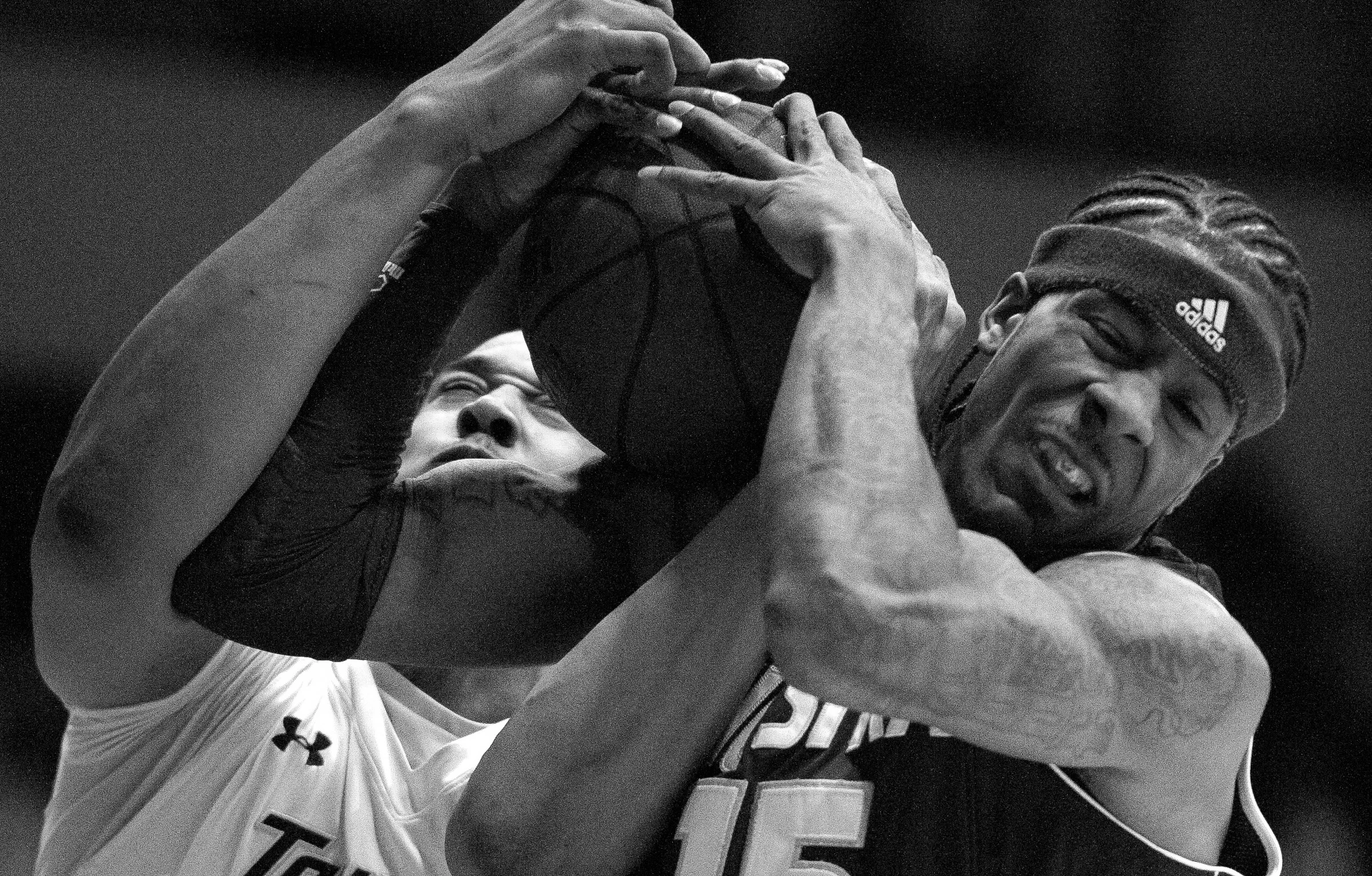 Towson University center Bilal Dixon fights for the ball during the final game of the 2012-2013 season on March 2, 2013 in Baltimore, Md. Towson University won by three points with a score of 67-64.