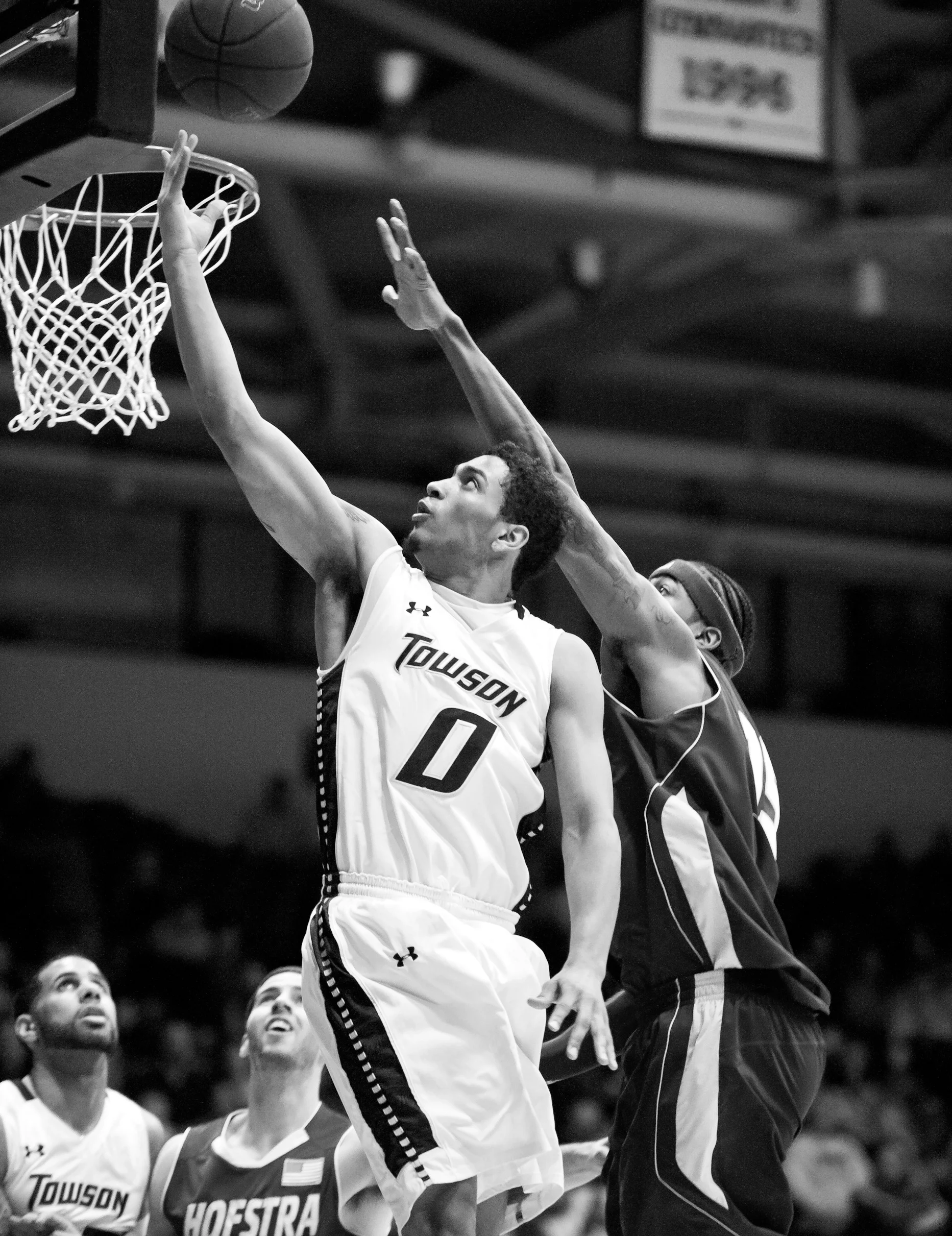 Towson University men's basketball guard Jerome Hairston rushes through
Hofstra University defense to score on March 2, 2013 in Baltimore, Md.
Towson University set the NCAA record for largest turnaround season with
17.5 win improvement over the 2012 season.