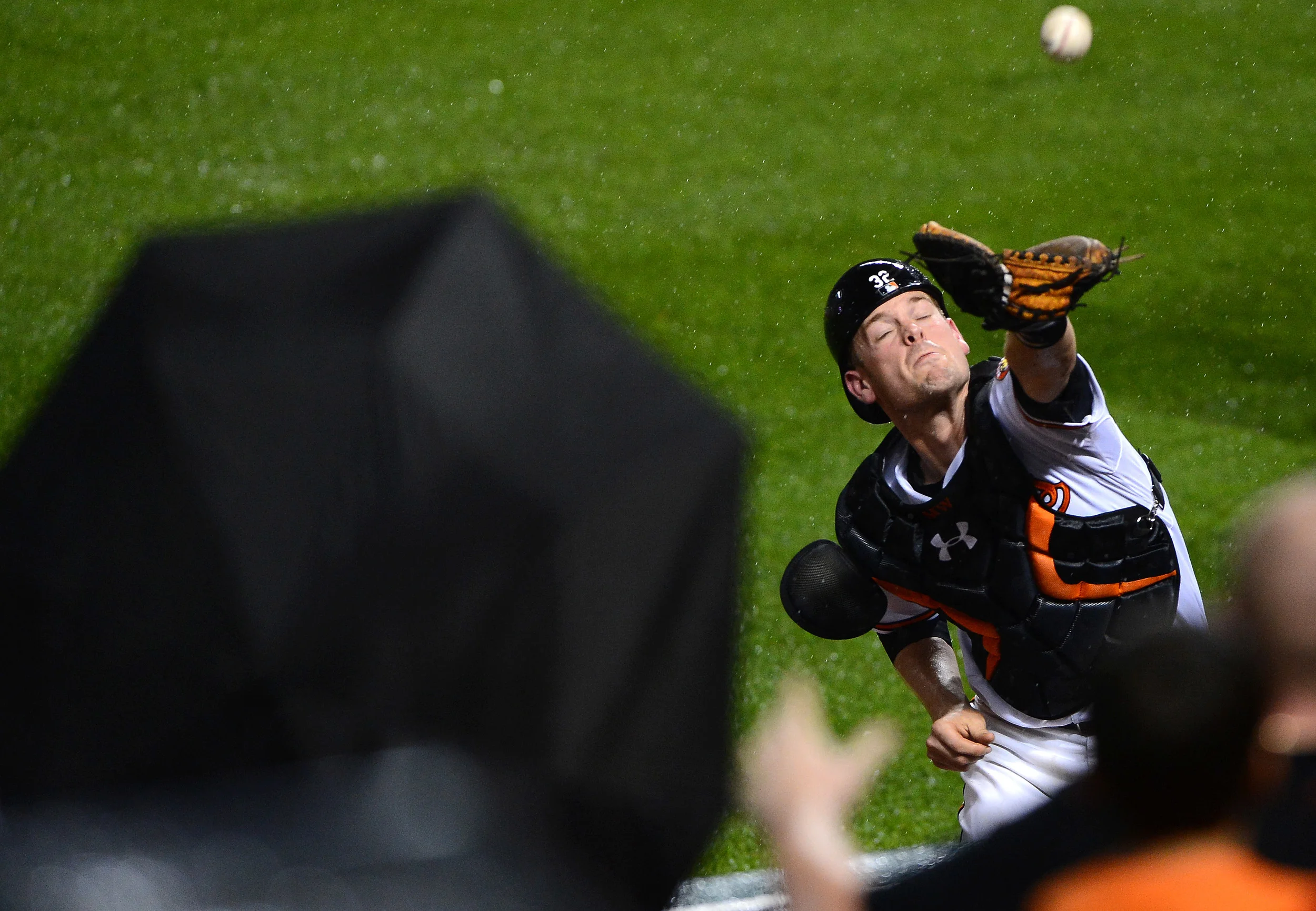 Baltimore Orioles catcher Matt Wieters dives into the stands after a foul ball on June 10, 2013 in Baltimore, Md.