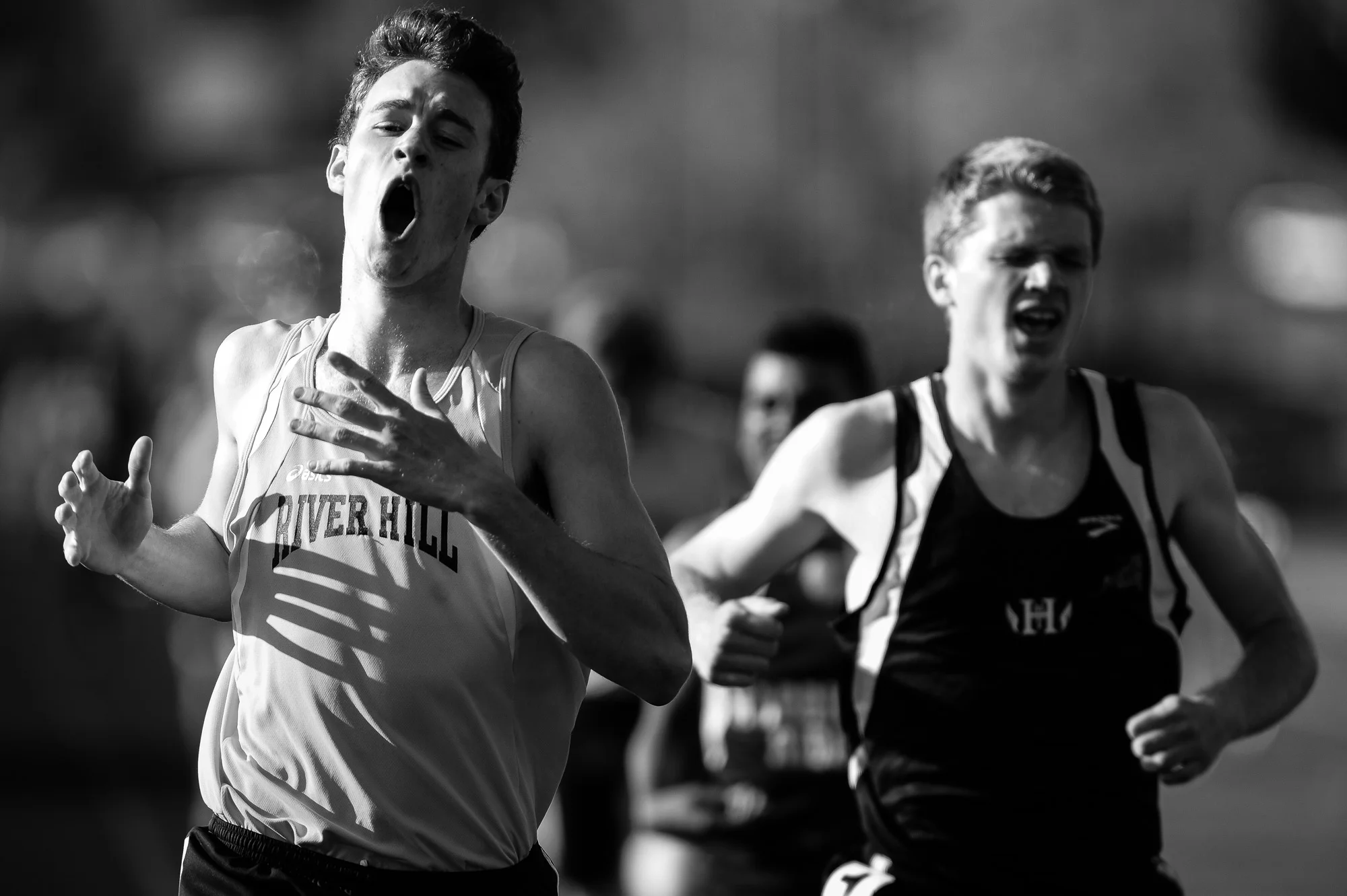 Chris Heydrick, left, of River Hill High School celebrates after winning the boys 800 meter run on the second day of the Howard County Track Championships at Wilde Lake High School in Columbia, Maryland on May 6, 2014.