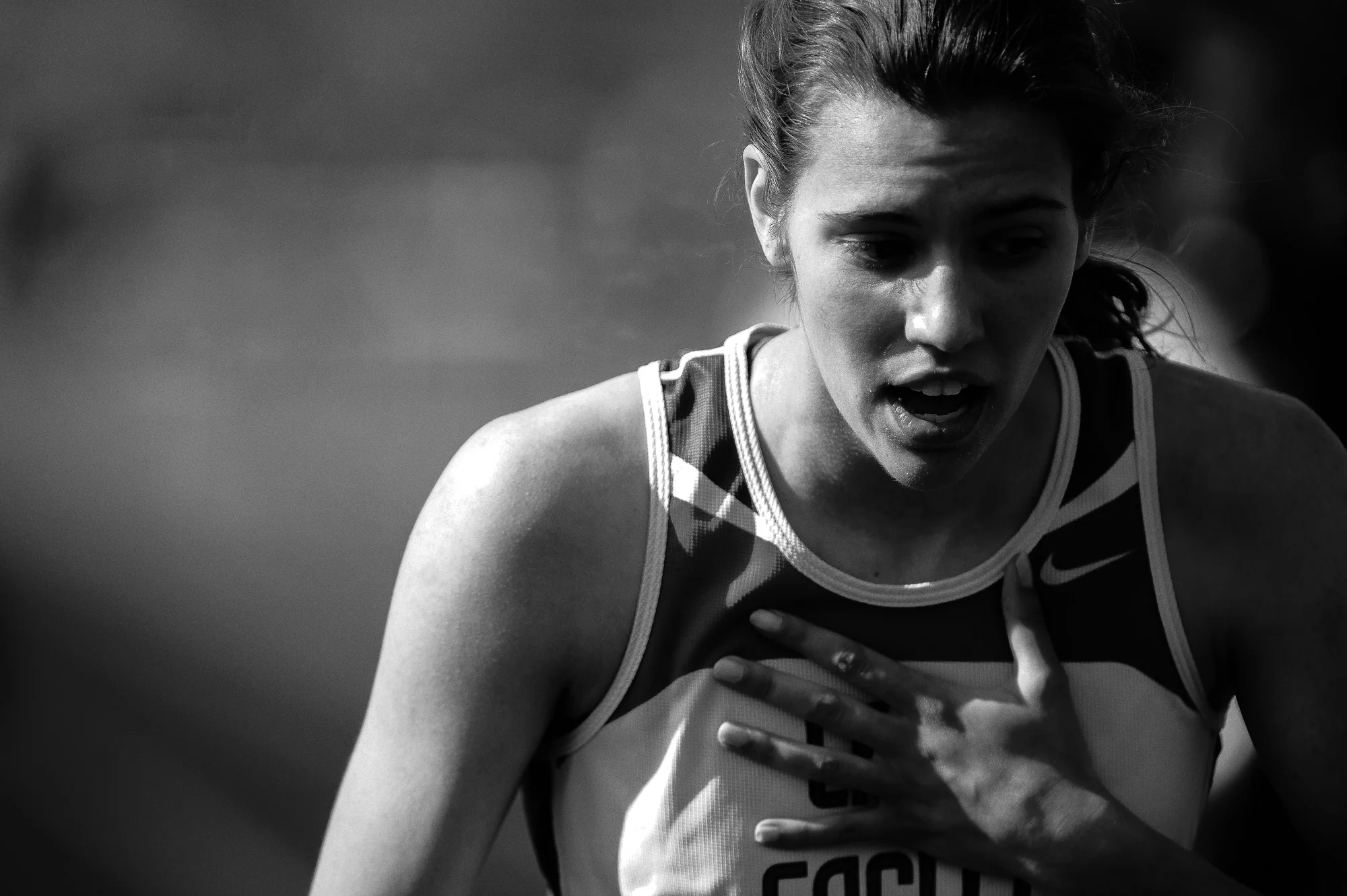 Alli Krahe of Centennial High School gasps for air after finishing the 400 meter dash during the second day of the Howard County Track Championships at Wilde Lake High School in Columbia, Maryland on May 6, 2014.