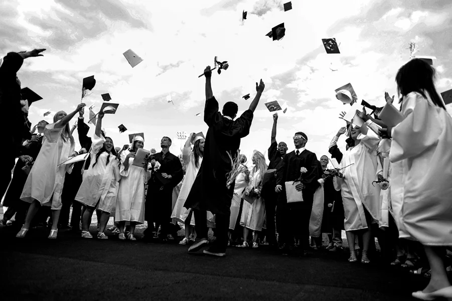 The Perryville High School class of 2014 celebrates at the conclusion of their graduation ceremony on June 5, 2014 in Perryville, Maryland.