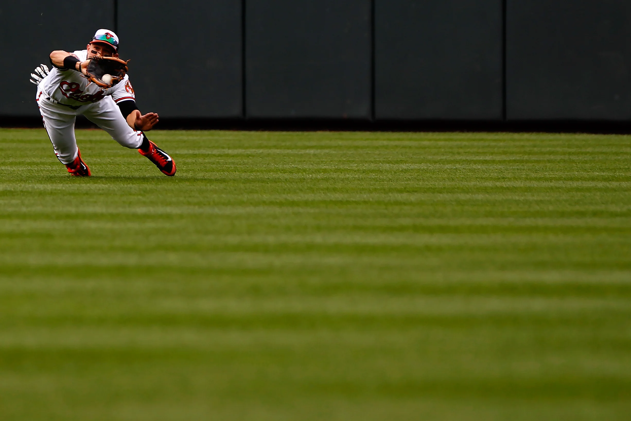Baltimore Orioles center fielder David Lough makes the catch during a game against the Oakland Athletics on June 8, 2014 at Oriole Park at Camden Yards in Baltimore, Maryland.