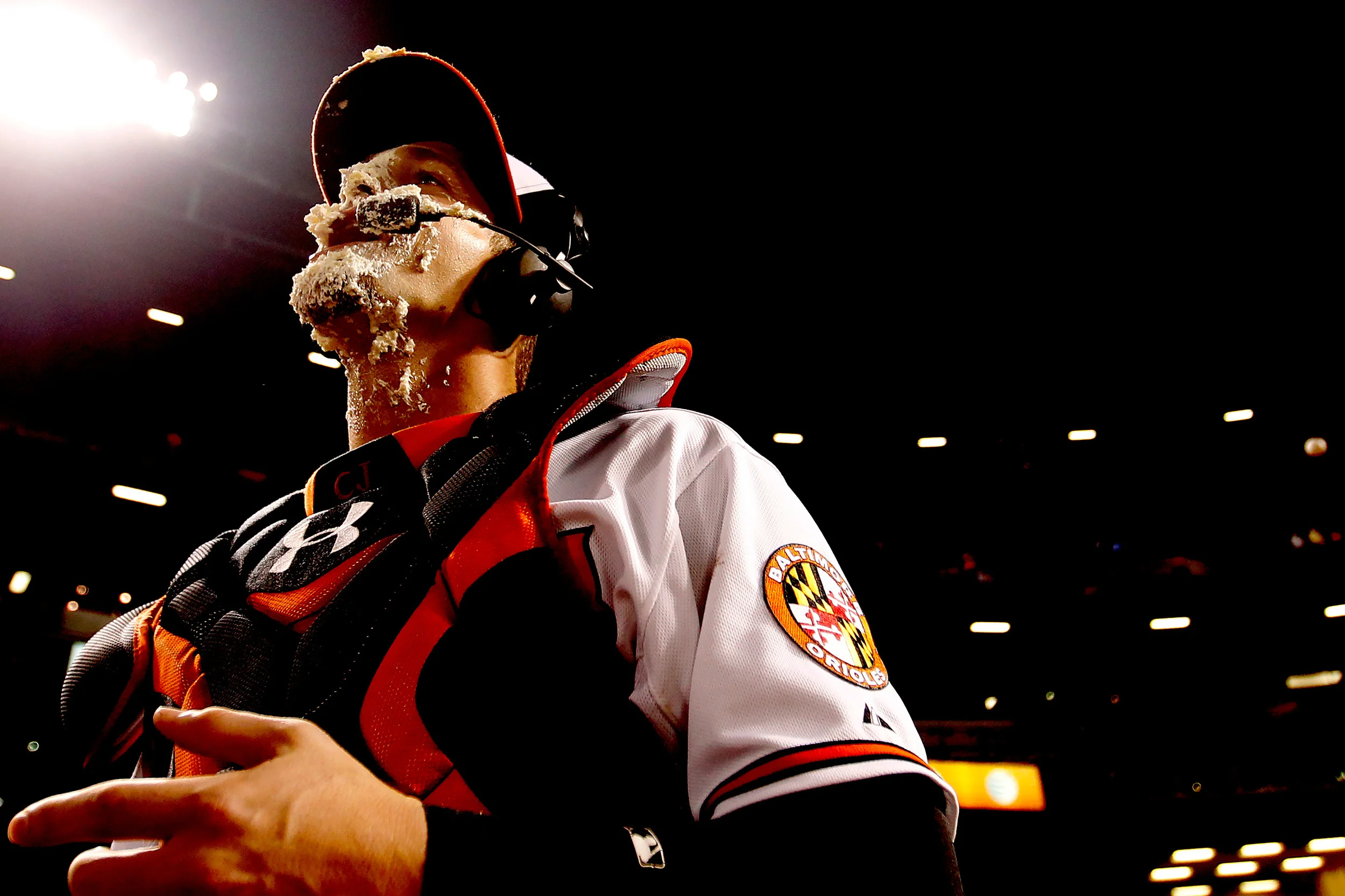 Baltimore Orioles catcher Caleb Joseph licks pie off of his face after the conclusion of a MLB game against the Toronto Blue Jays at Oriole Park at Camden Yards in Baltimore, Maryland on June 12, 2014