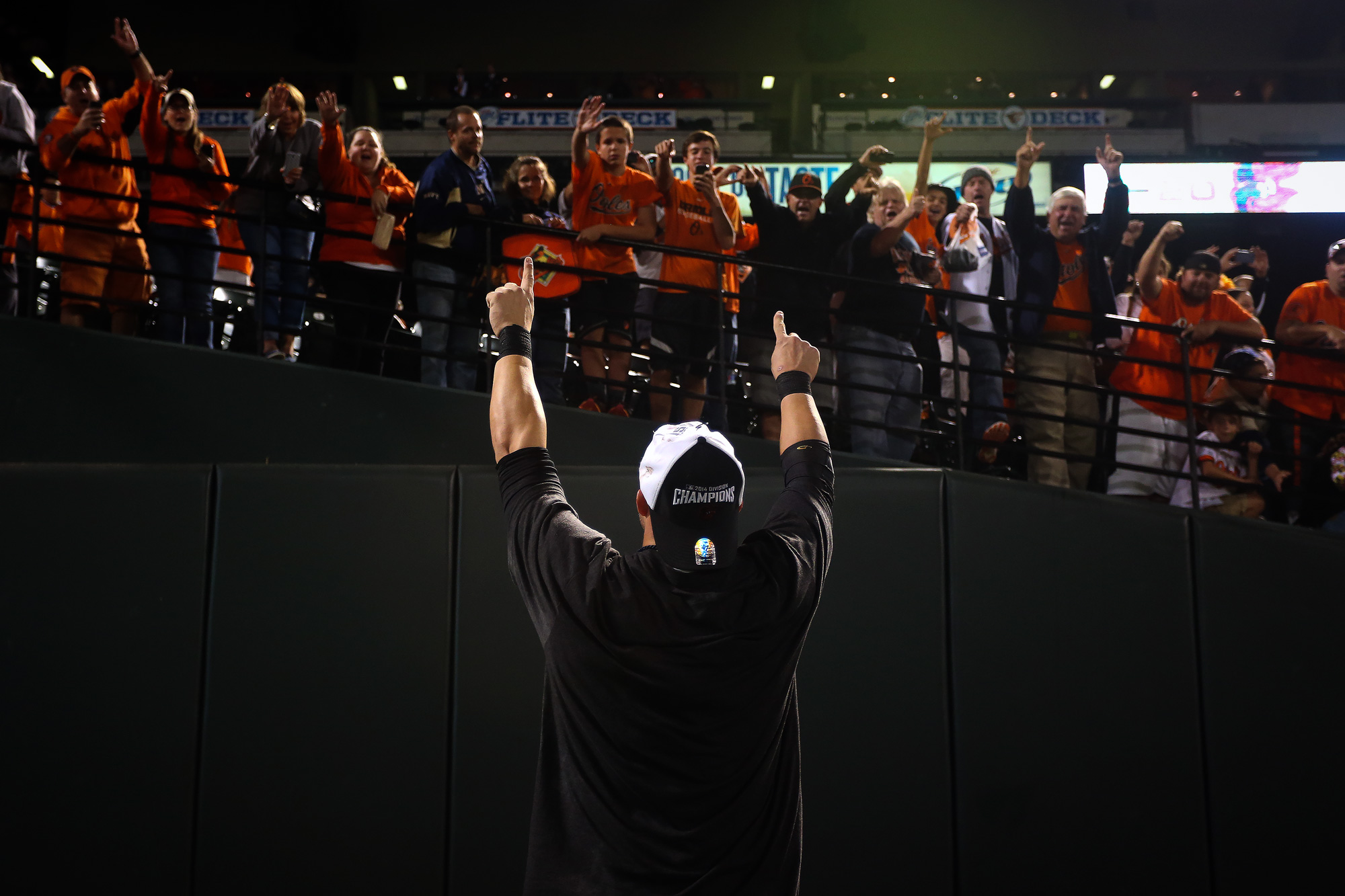 First baseman Steve Pearce of the Baltimore Orioles celebrates with fans after the Orioles defeated the Toronto Blue Jays to clinch the American League East Division at Oriole Park at Camden Yards in Baltimore, Maryland on Sept. 16, 2014. 