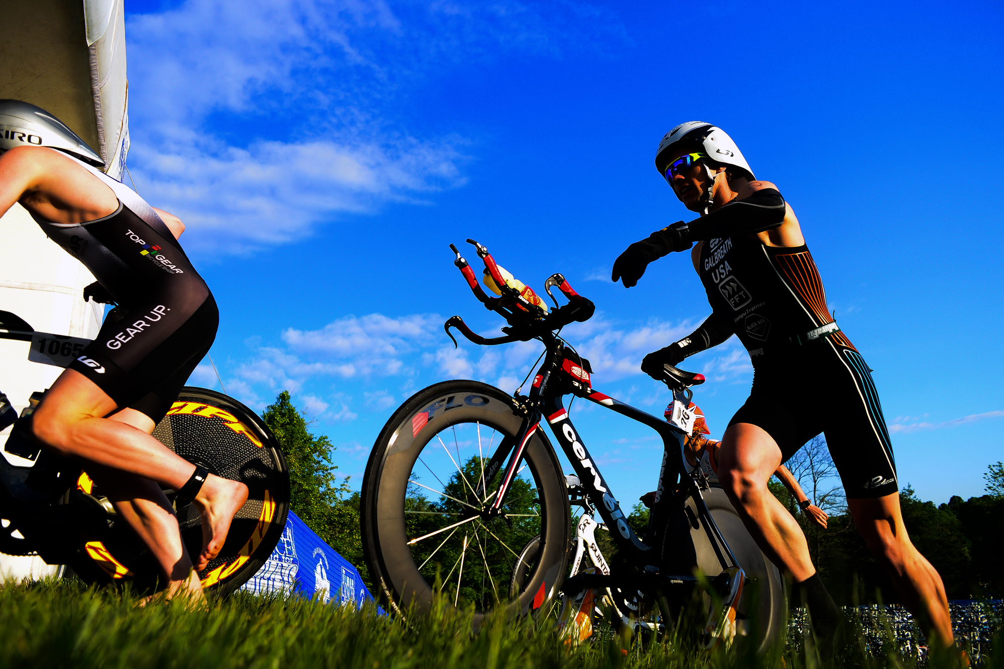  Justin Galbreath, right, of Coatesville, Pennsylvania races his bike up a hill&nbsp;during&nbsp;the 31st annual Columbia Triathlon at Centennial Park in Ellicott City, Maryland on&nbsp;May 18, 2014. 