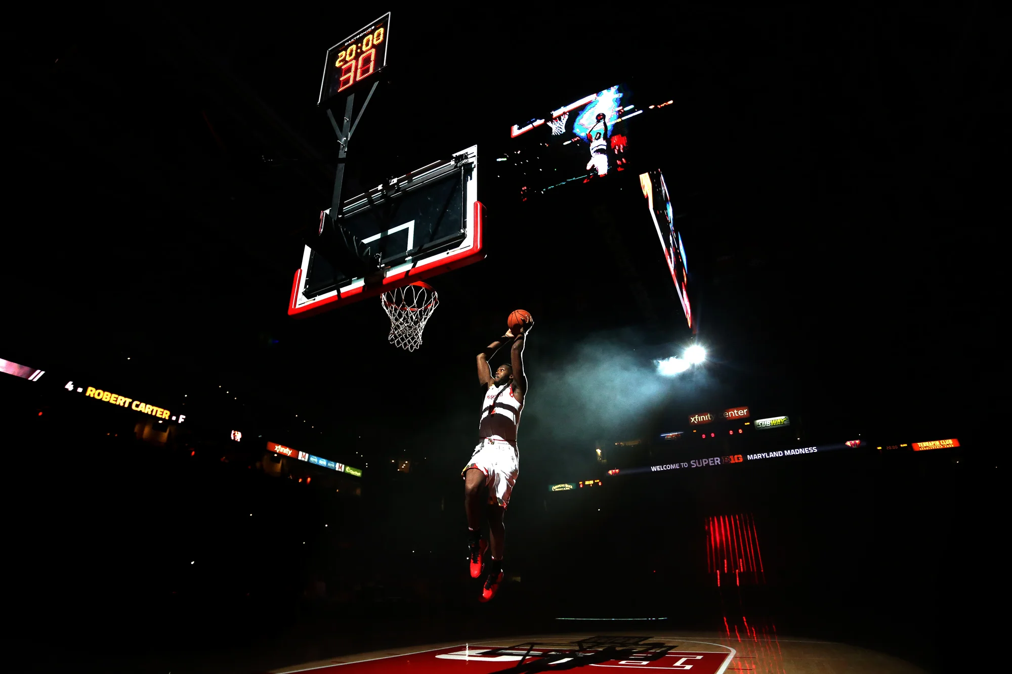 Robert Carter of University of Maryland dunks after being introduced during Maryland Madness at Xfinity Center in College Park on Friday, Oct. 17, 2014. 
