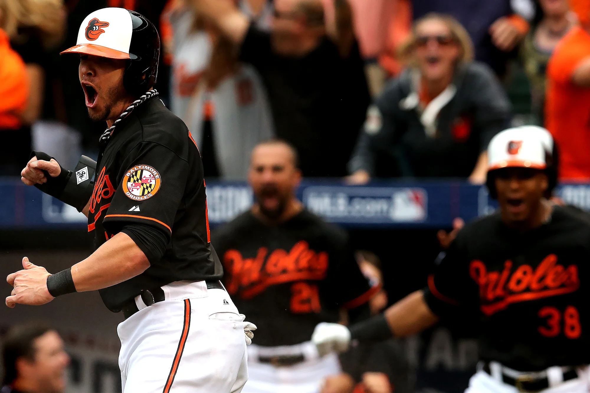 Baltimore Orioles first baseman Steve Pearce celebrates after Delmon Young hit a double during Game Two of the American League Division Series against the Detroit Tigers at Oriole Park at Camden Yards on October 3, 2014 in Baltimore, Maryland. 