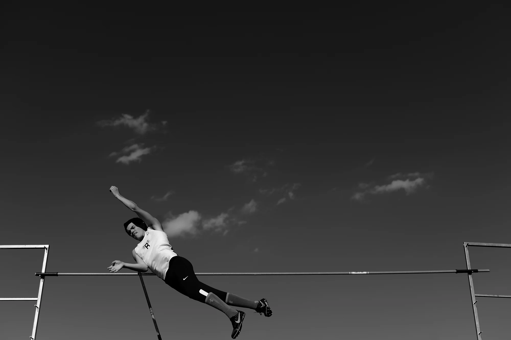 Dan Larkin of Reservoir High School competes in the pole vault competition on the second day of the Howard County Track Championships at Wilde Lake High School in Columbia, Maryland on May 6, 2014.