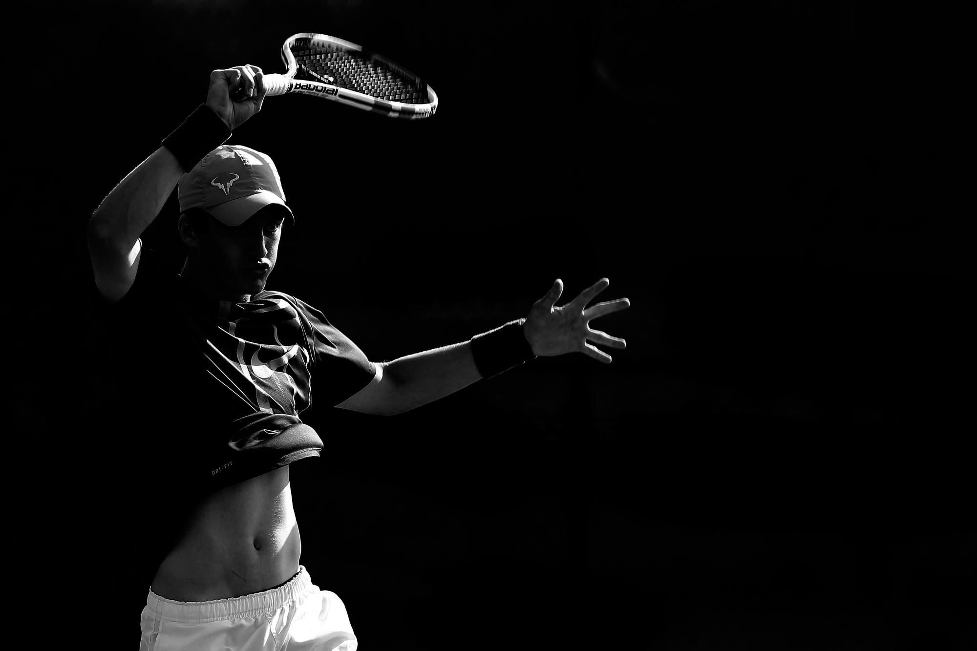 Reid Burch, 18, of Lutherville-Timonium, Maryland returns a serve with a forehand from opponent Blaise Schuster, not pictured, during the Columbia Junior Open tennis tournament in Columbia, Maryland on July 16, 2014.
