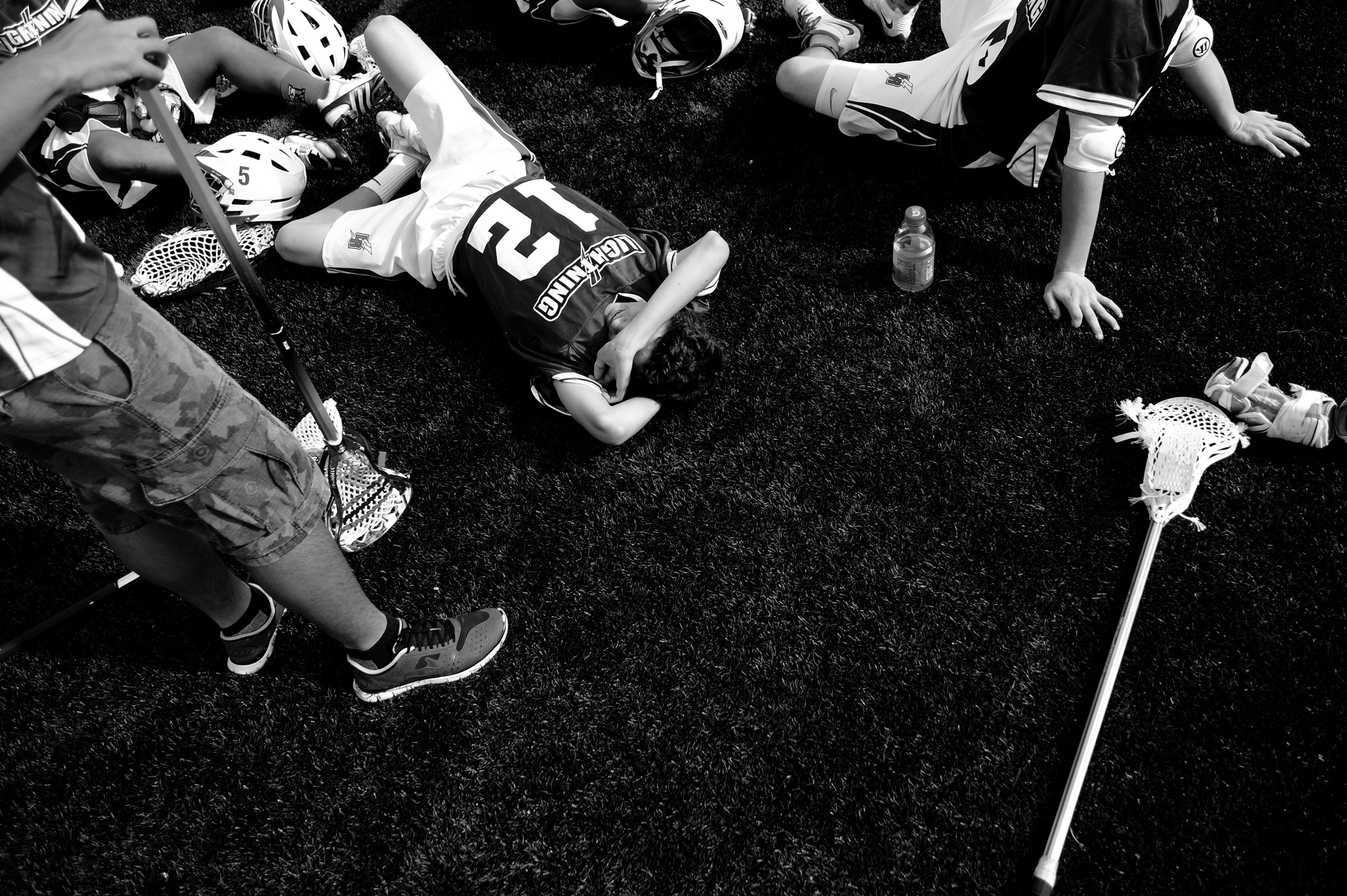 Anthony Valenza of Long Reach High School rests during halftime during a boy's lacrosse game against Wilde Lake High School on April 19, 2014 in Columbia, Maryland.