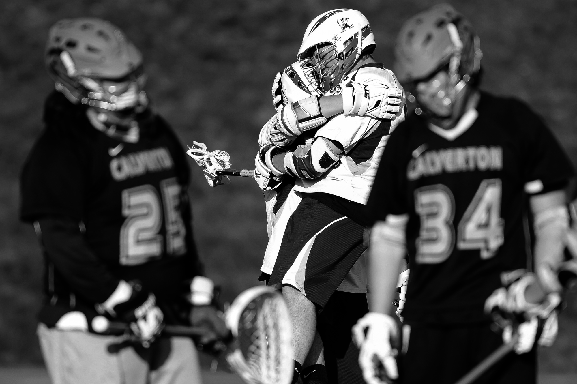 Brett Altenburg, second from left, of Mount Saint Joseph's celebrates with teammate Sam Sears after Sears scores during a boy's lacrosse game in Baltimore, Maryland on April 17, 2014. 