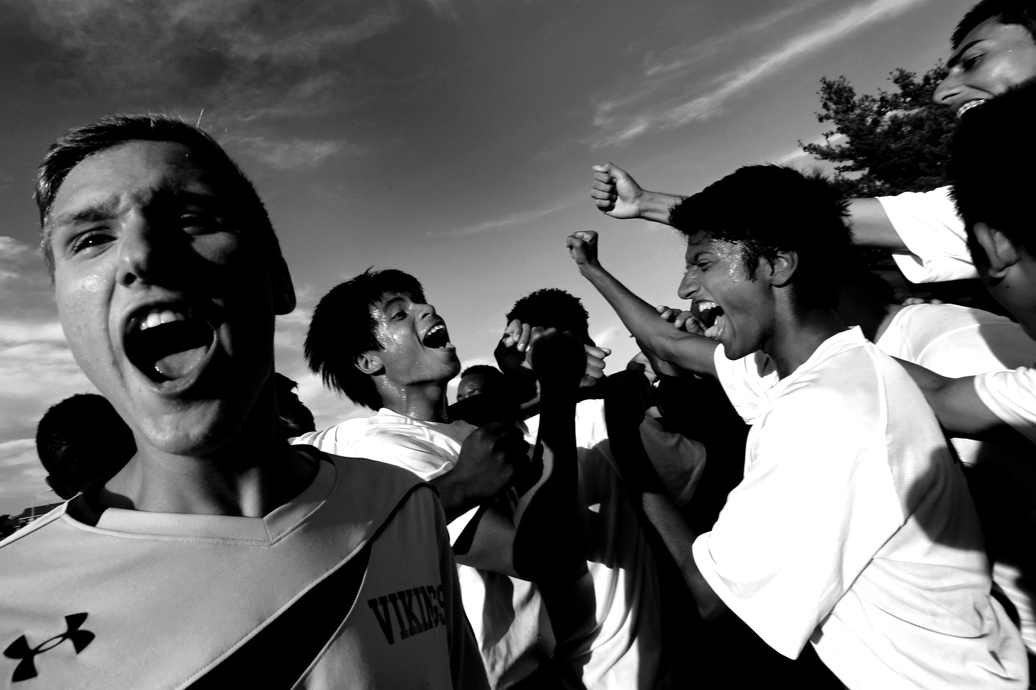Members of the Landsdowne High School boys soccer team celebrate after winning in double over time against Overlea High School on Sept. 23, 2014 in Landsdowne, Maryland. 