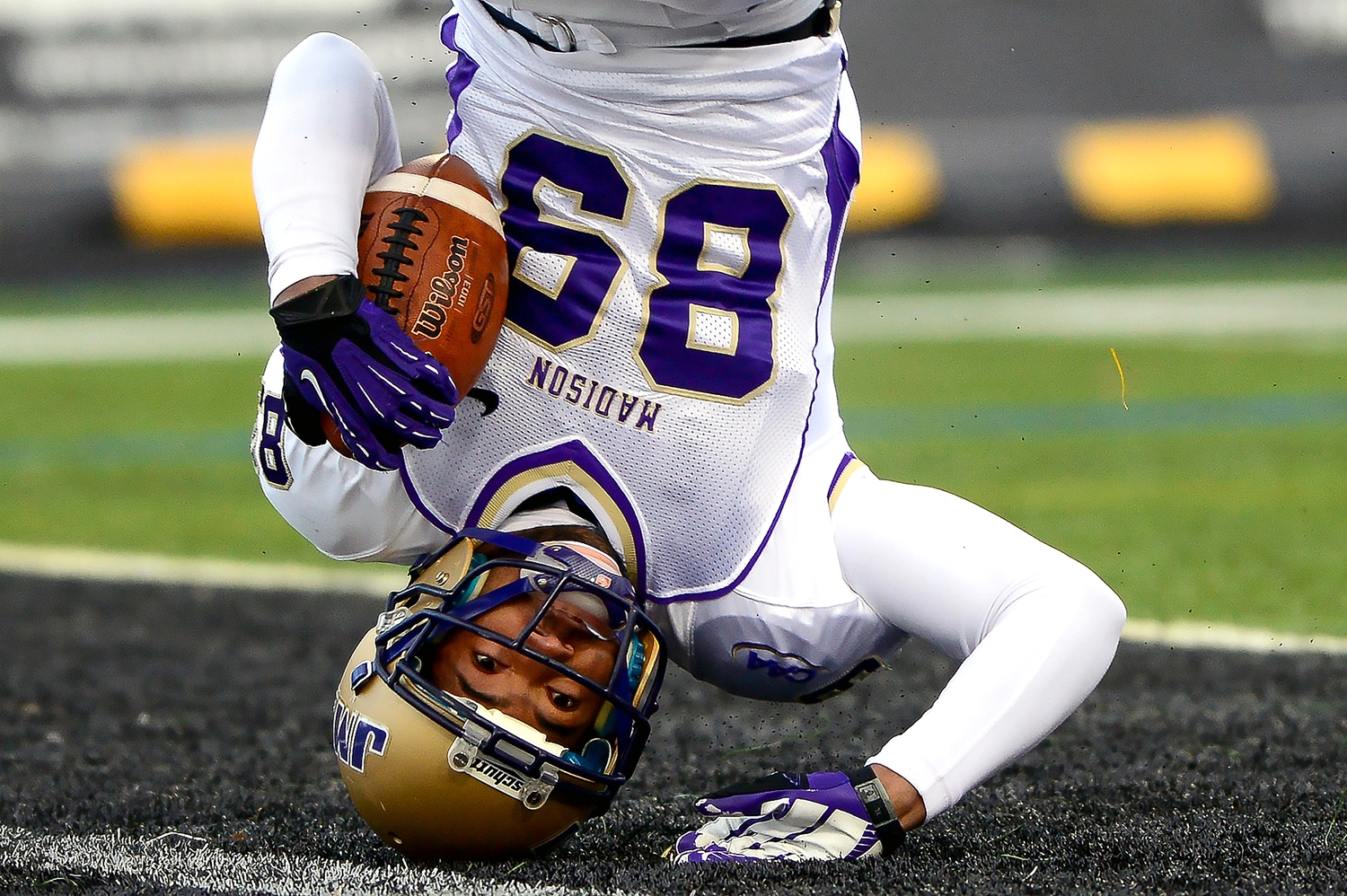  James Madison University wide receiver Anthony Rose slides on his head into the end zone to put JMU up 7-0 in the first quarter on Nov. 23, 2013 in Baltimore, Md. 