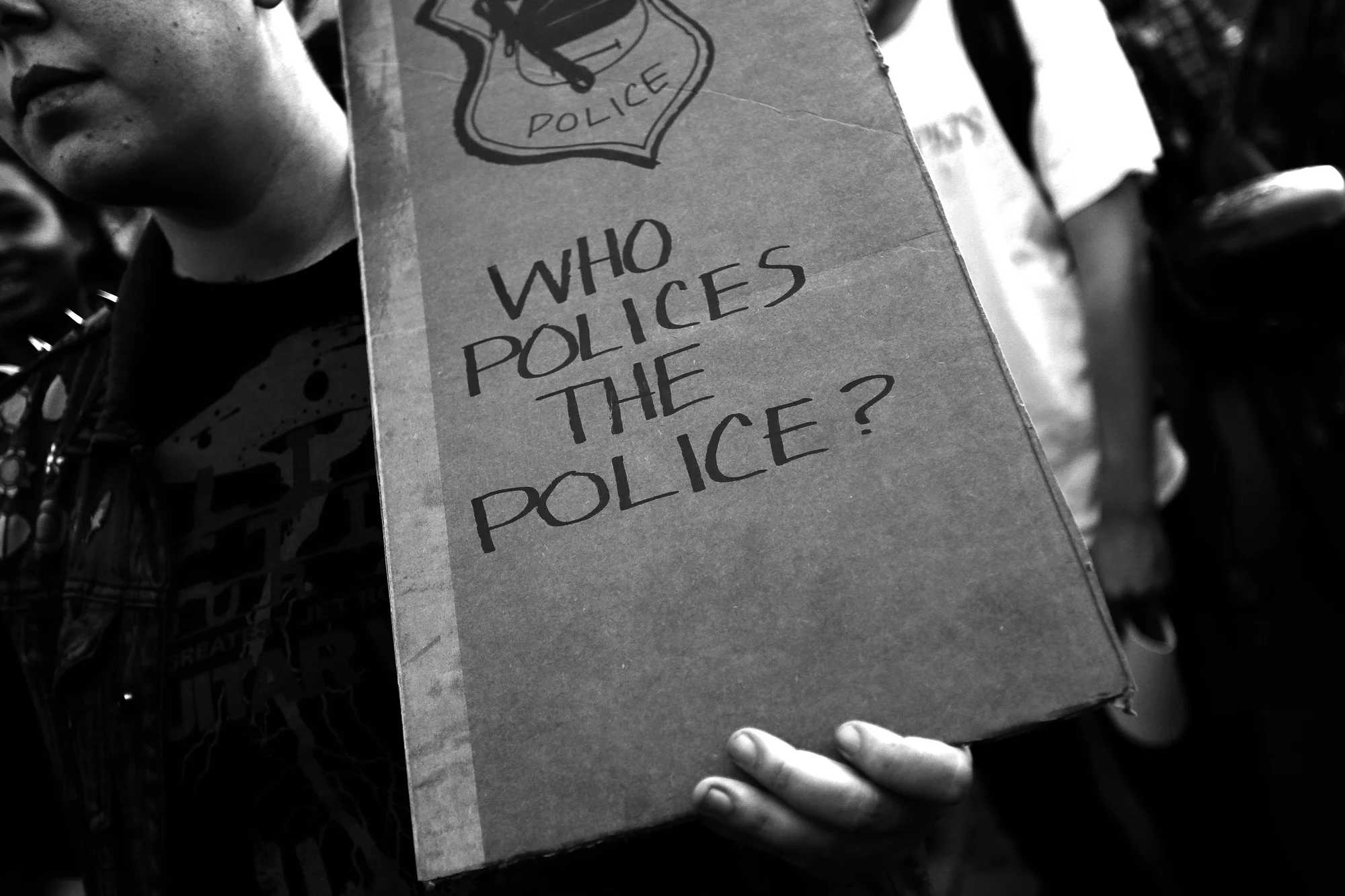 A protestor stands in front of City Hall during a protest in response to the death of Freddie Gray while he was held in police custody, April 29, 2015 in Baltimore, Maryland.