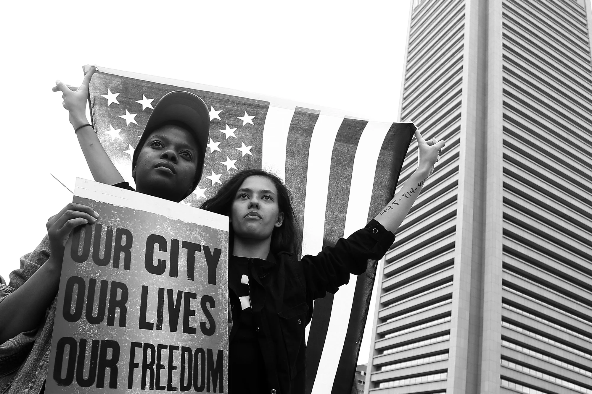 Protestors stand in the intersec tion of Pratt Street and Light Street after the announcement that all six officers will be charged following the death of Freddie Gray while he was in police custody, May 1, 2015 in Baltimore, Maryland.