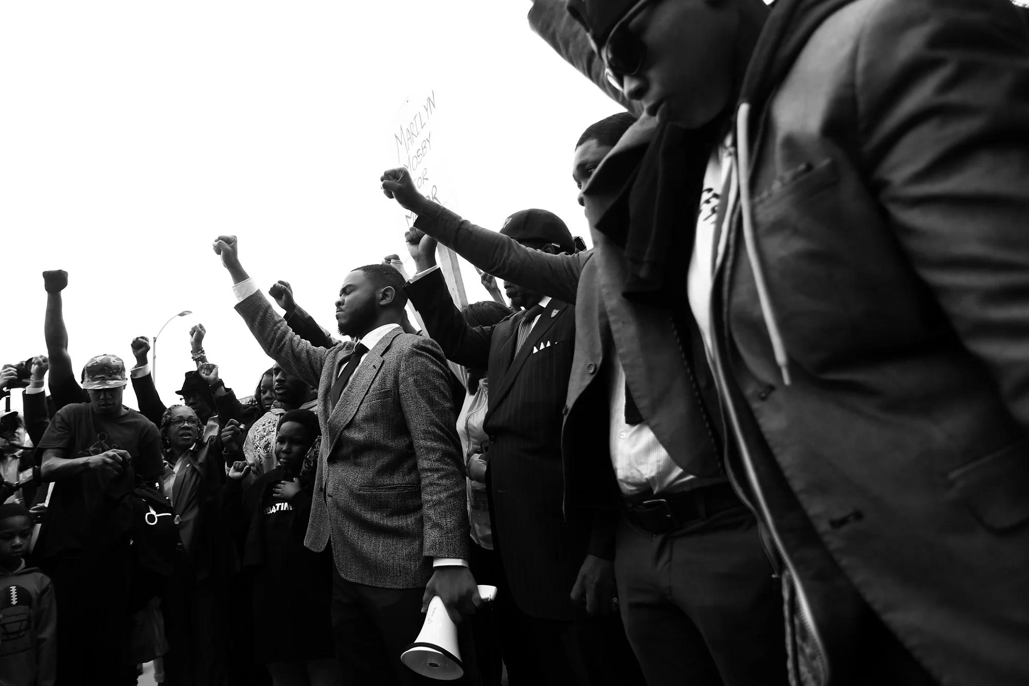 Protestors pray before beginning a march around the Baltimore City Detention Center on 401 E. Eager Street after the announcement that all six officers will be charged following the death of Freddie Gray while he was in police custody, May 1, 2015 in Baltimore, Maryland.