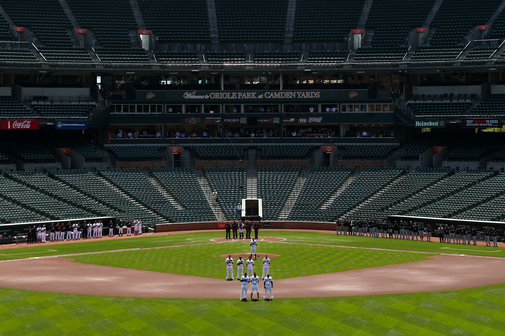  The Baltimore Orioles and Chicago White Sox stand for the nation anthem at an empty Oriole Park at Camden Yards on April 29, 2015 in Baltimore, Maryland. 