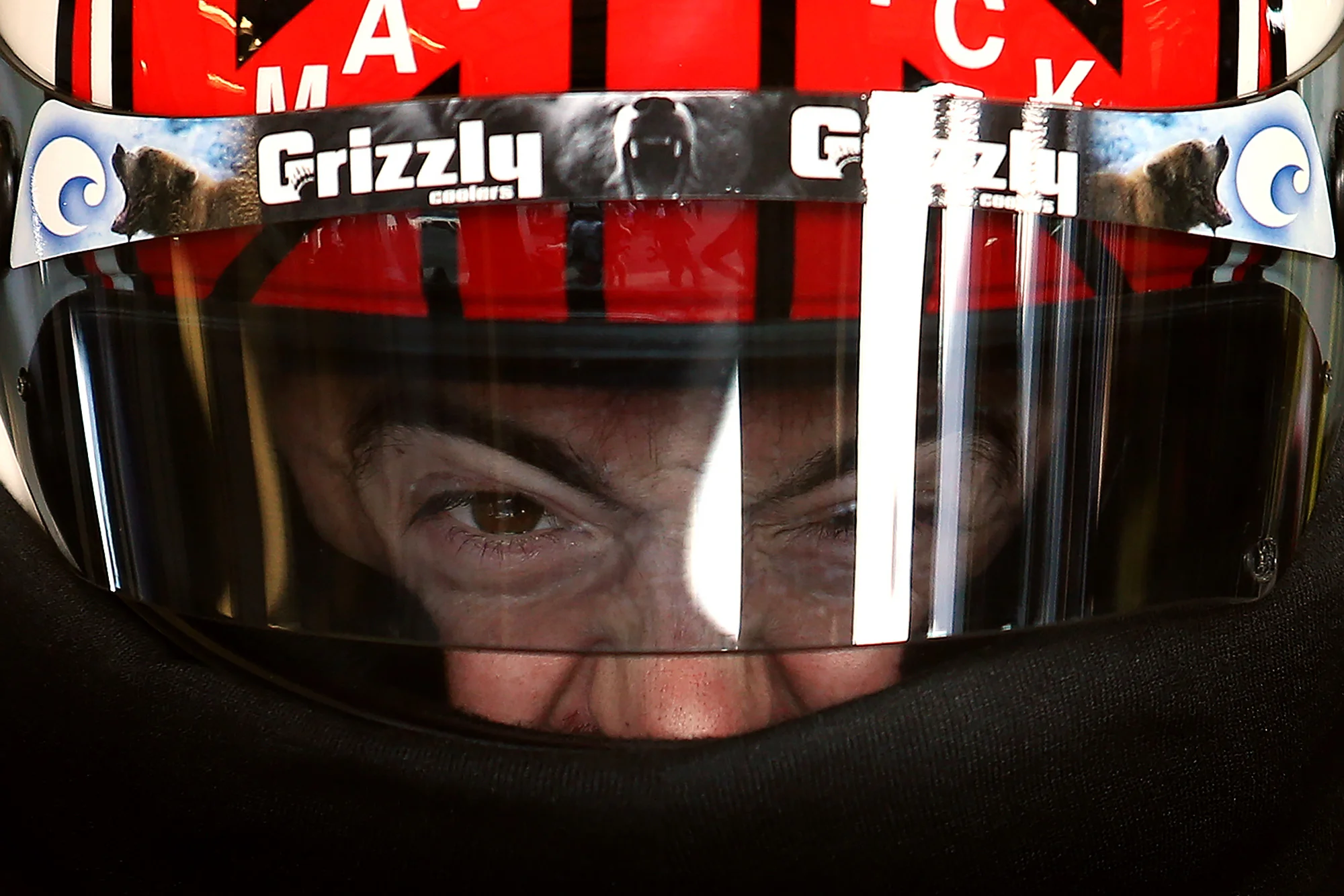 Austin Dillon, driver of the #3 DOW Chevrolet, adjusts his helmet in the garage area during practice for the NASCAR Sprint Cup Series Quaker State 400 at Kentucky Speedway on July 8, 2016 in Sparta, Kentucky.