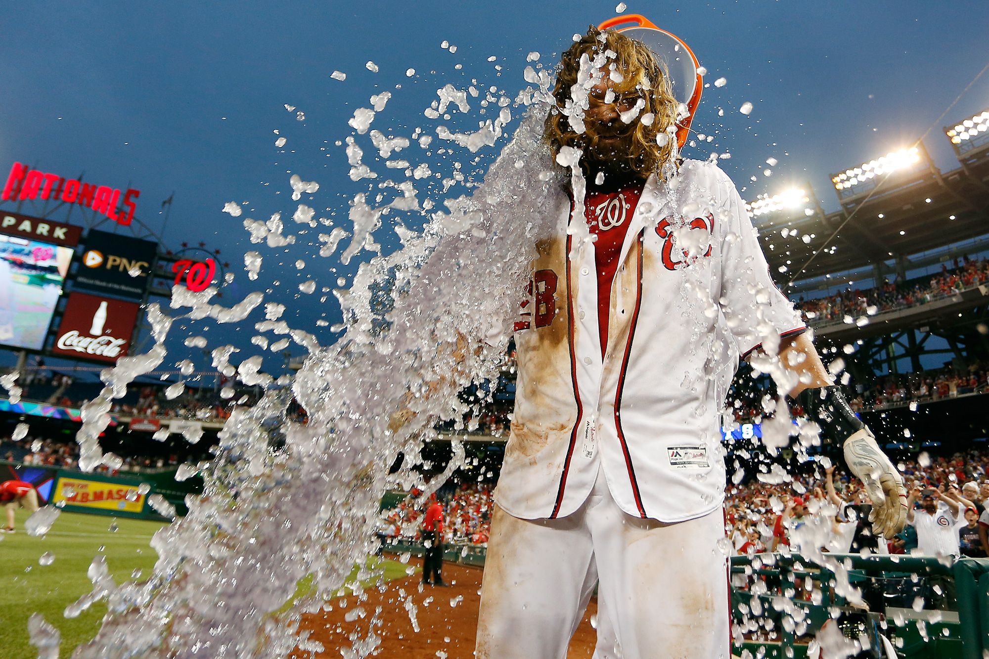  Jayson Werth #28 of the Washington Nationals is doused with a bucket of Gatorade by teammate Wilson Ramos #40 after hitting a walk-off single RBI in the twelfth inning against the Chicago Cubs at Nationals Park on June 15, 2016 in Washington, DC. 