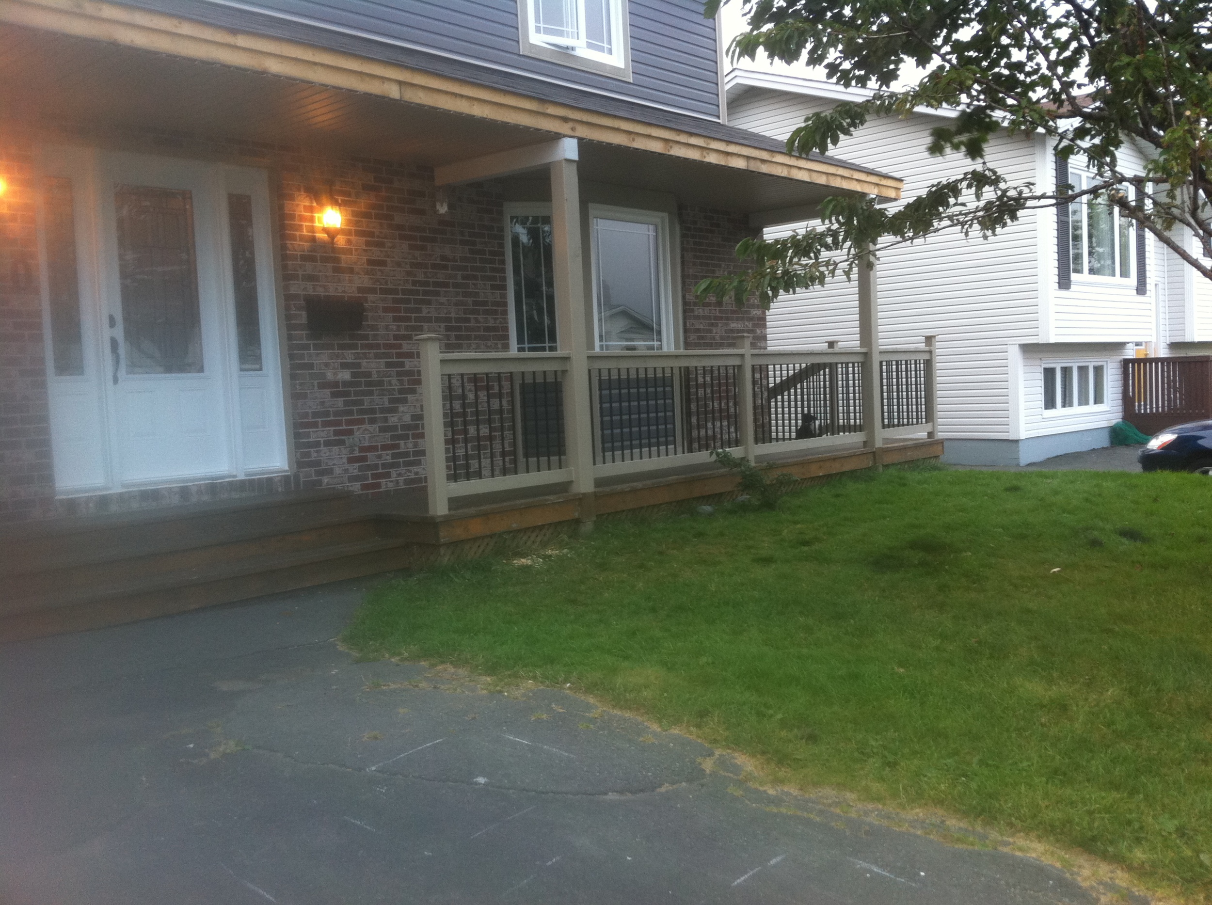 New windows, doors, siding and porch rail