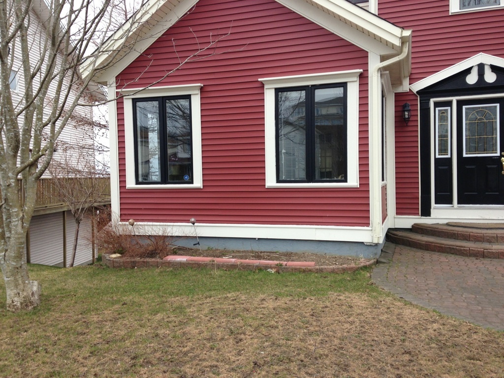 Before - black windows and door with improper stonework