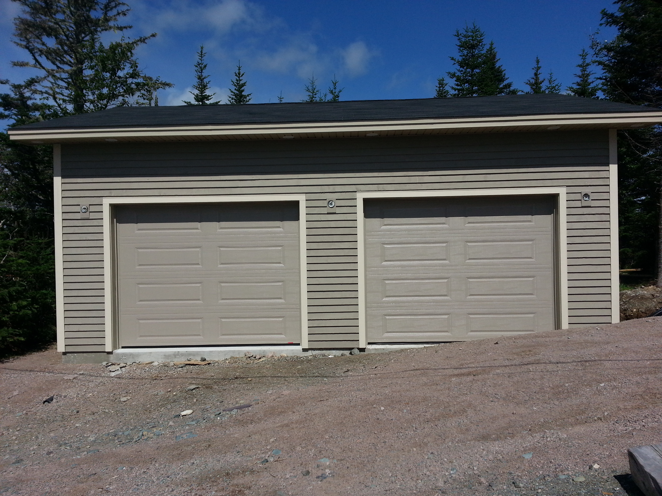 Factory finished garage doors.  Ready for light fixtures. 