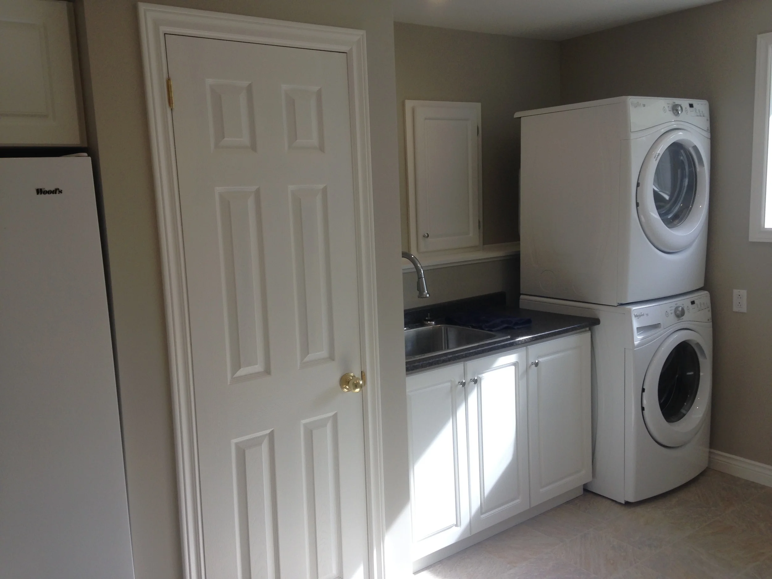 Closet hiding water heater and covered panel