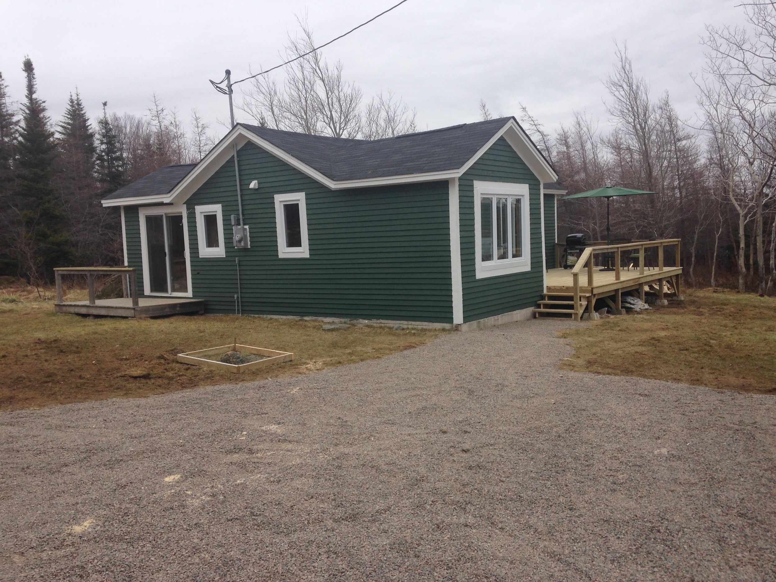 Complete exterior renovation including siding, shingles, deck and some windows/doors