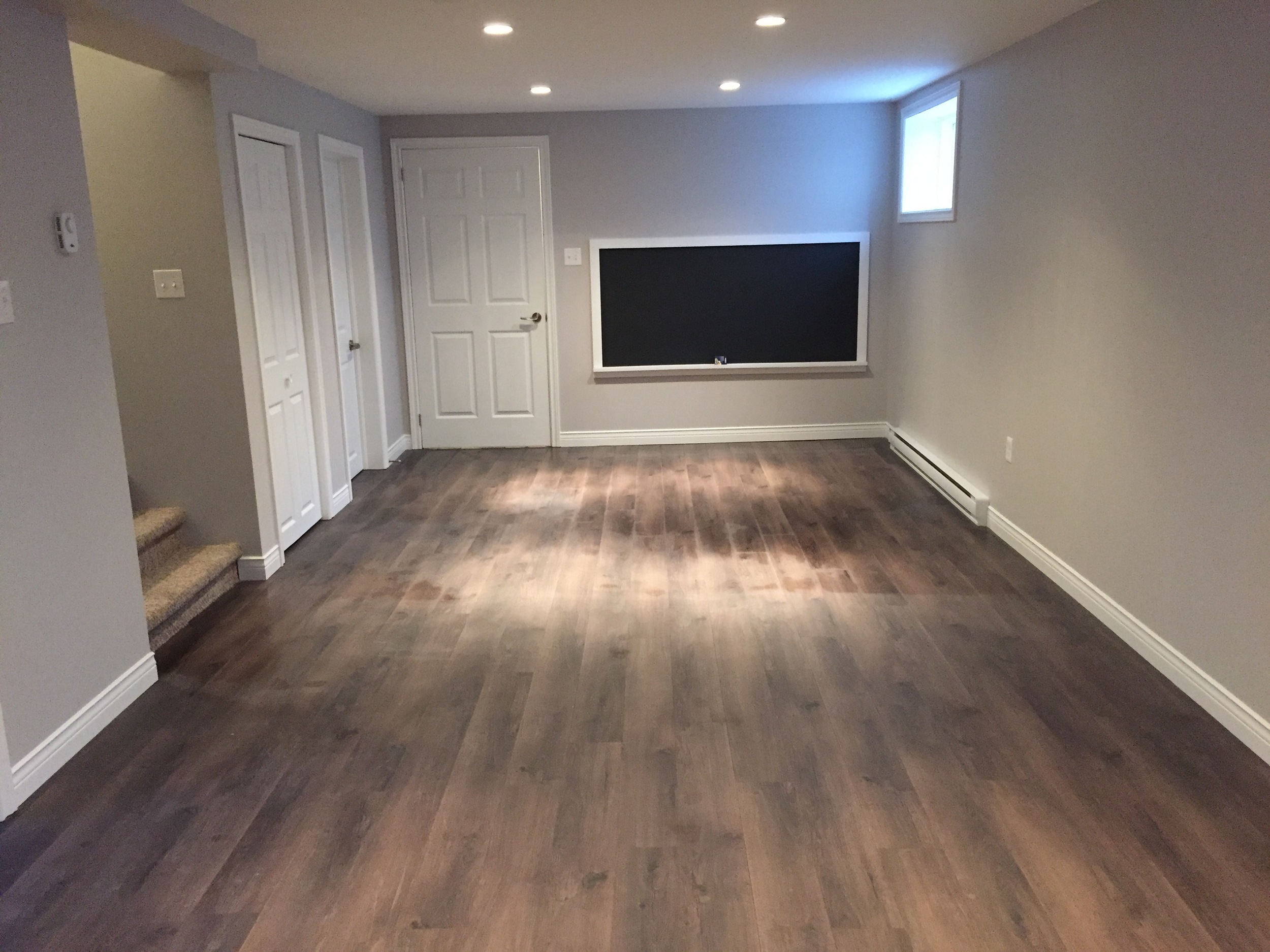 Play area with framed chalkboard (paint). 