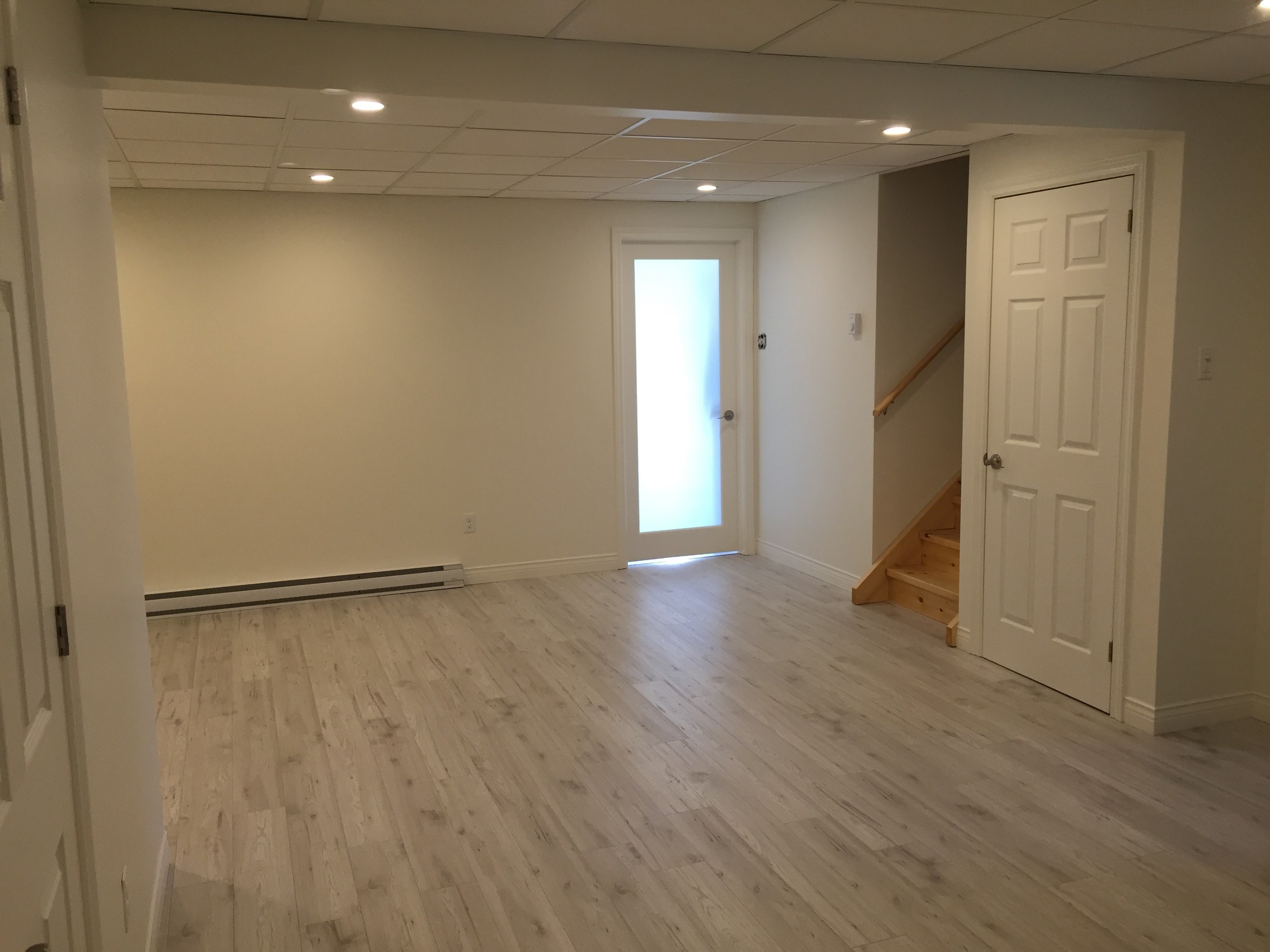 New rec room finished with plenty of light and neutral colours. 