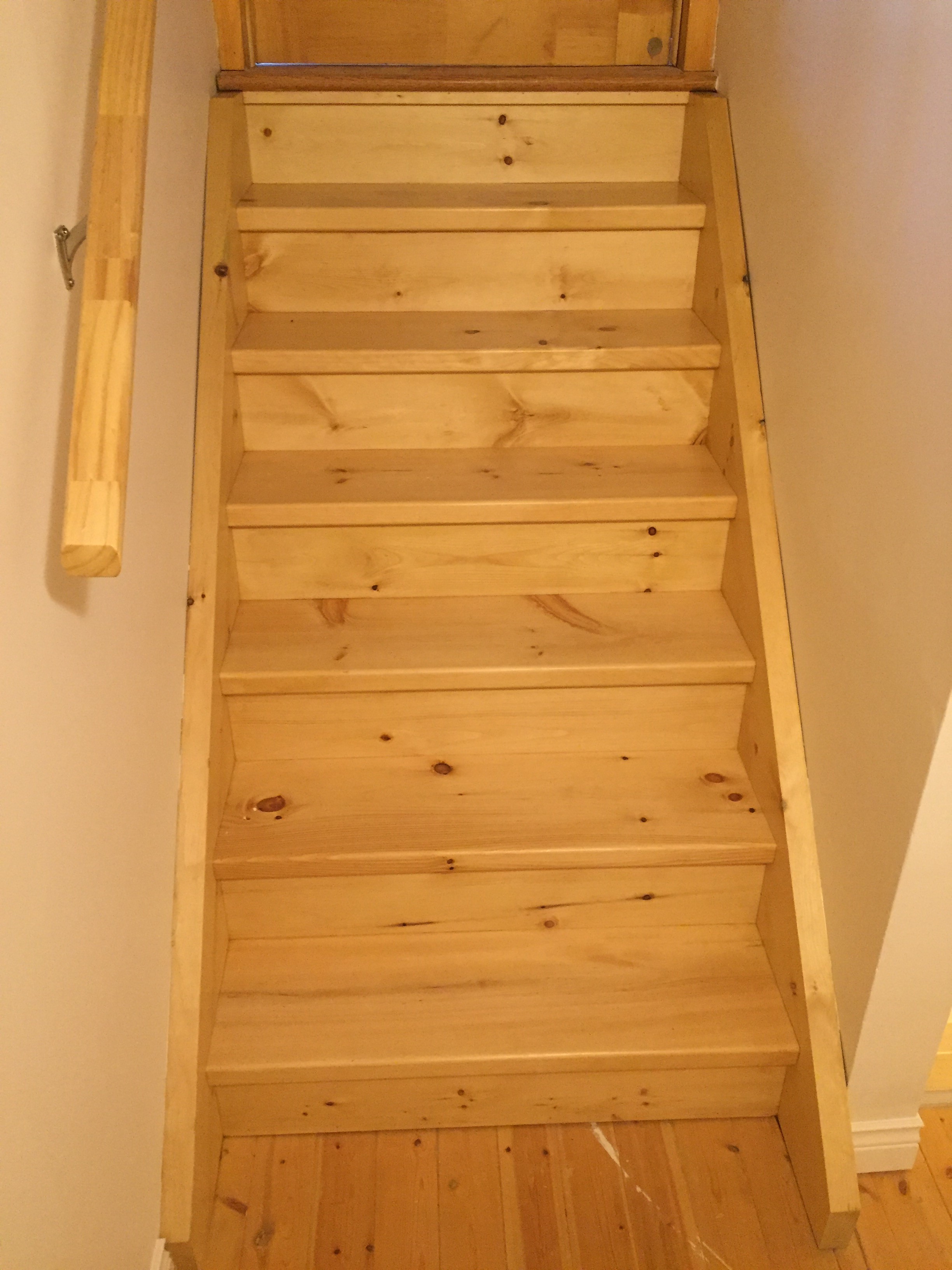 New custom pine stairs leading to main floor. 
