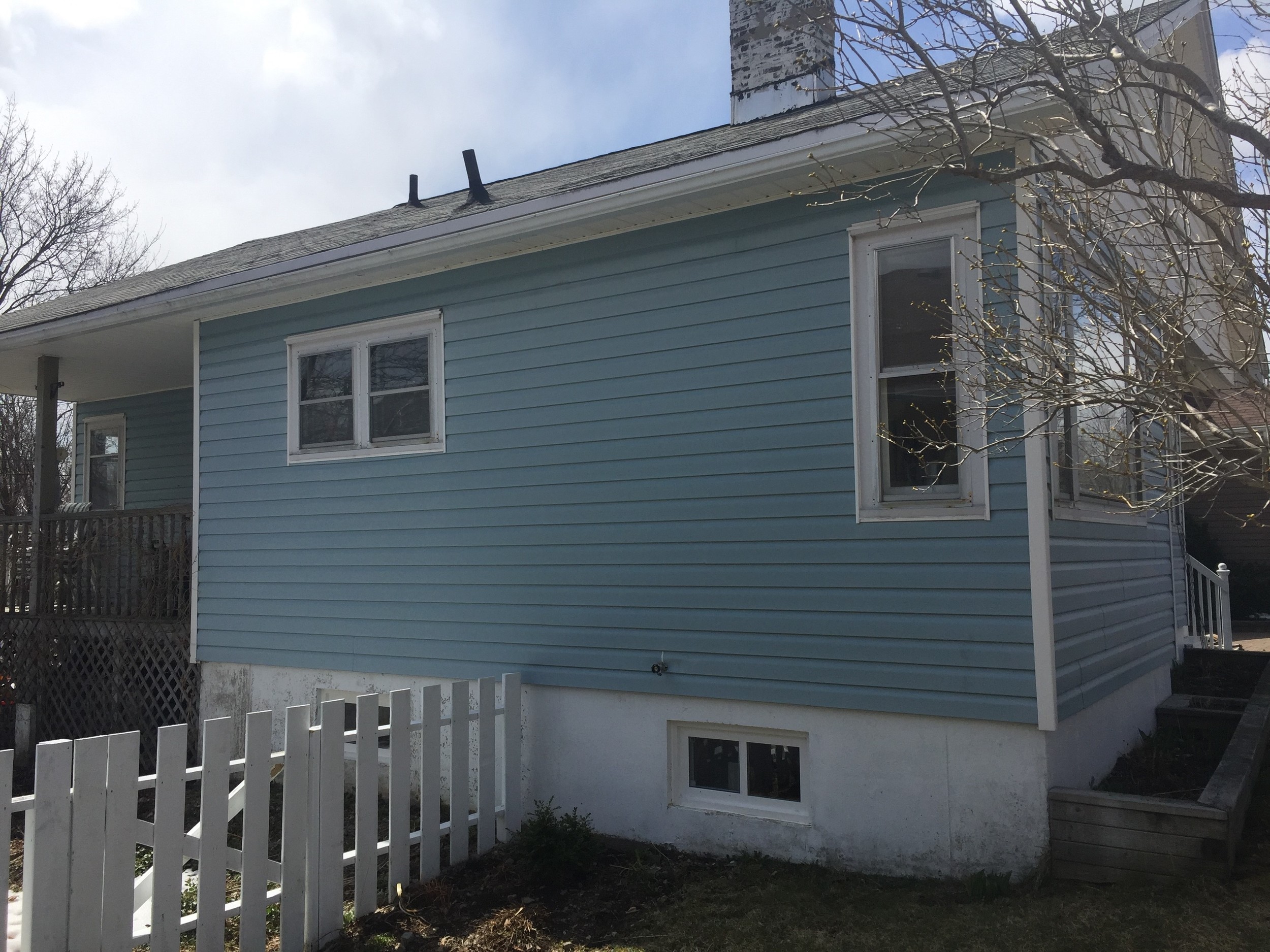 Before - Siding, windows, doors roof and chimney in need of replacement