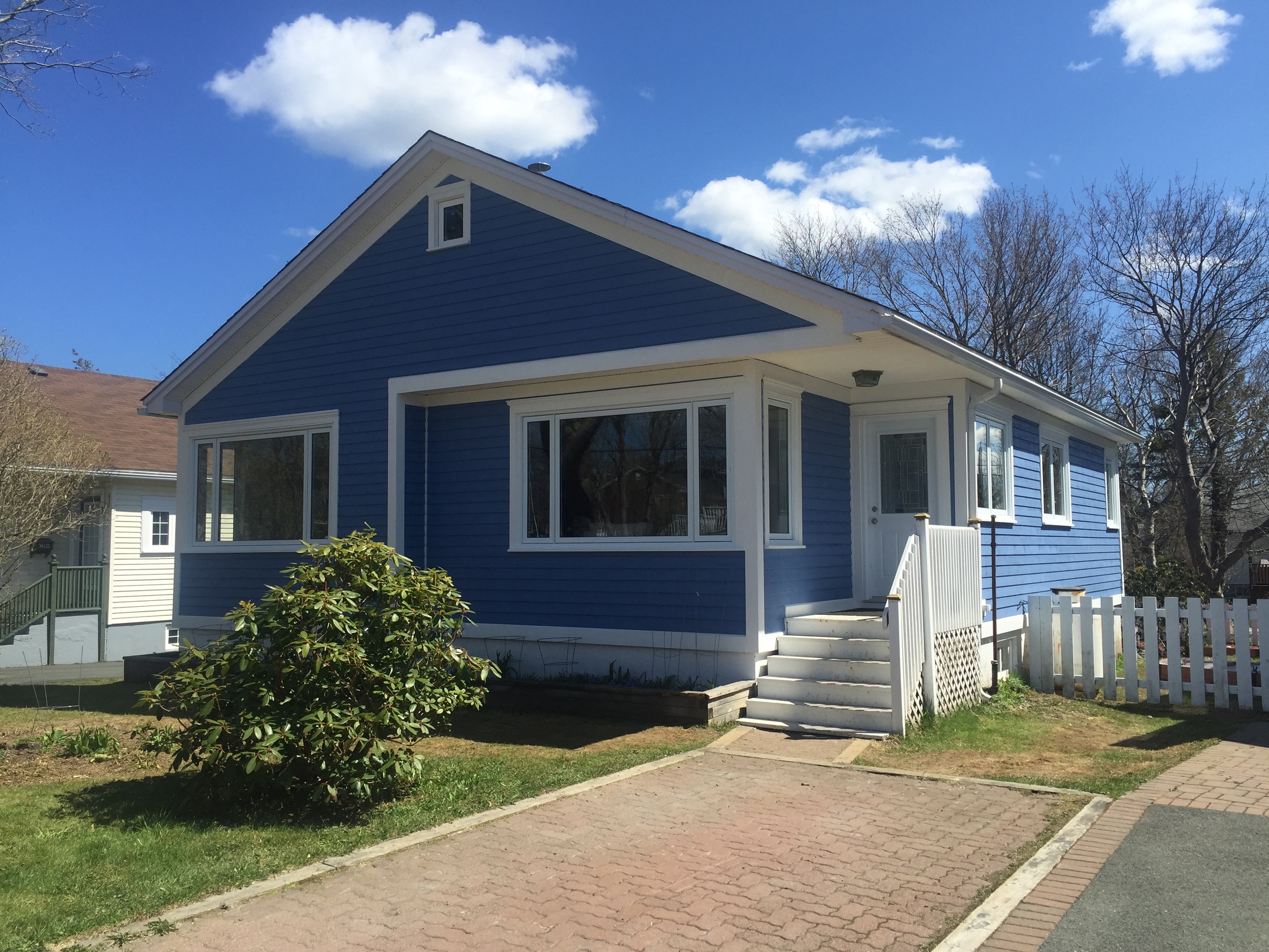 New Cape Cod siding, vinyl windows and new door. 