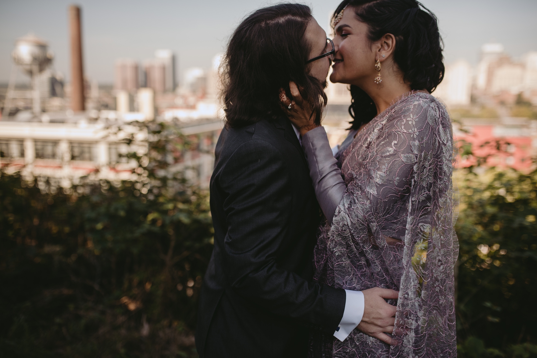 Feminist Wedding Photography Carly Romeo Photography Richmond VA Packistani Packistan Interracial Interfaith Skyline Cityscape Kiss Purple