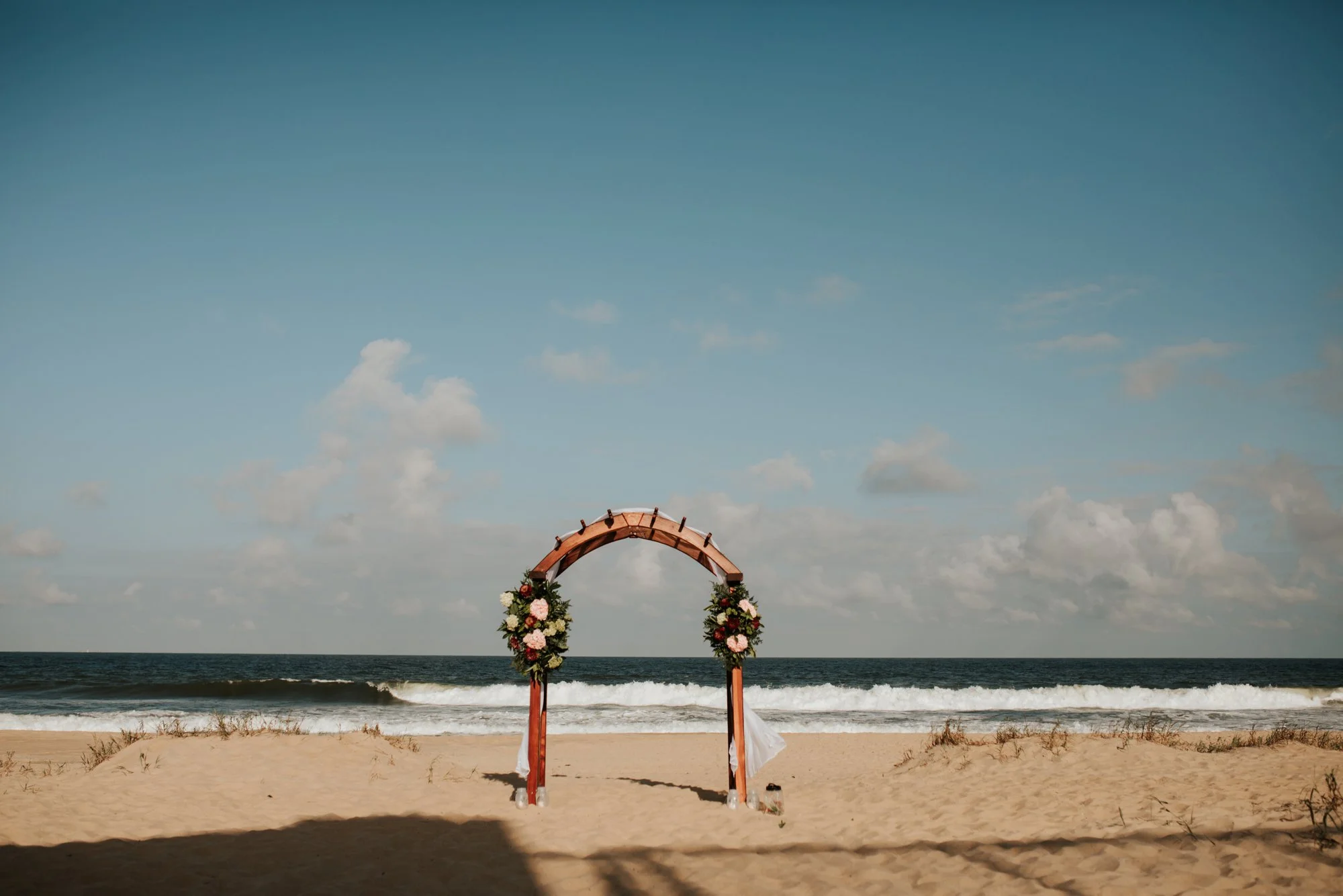 Backyard beach wedding in Sandbridge, VA ceremony arbor