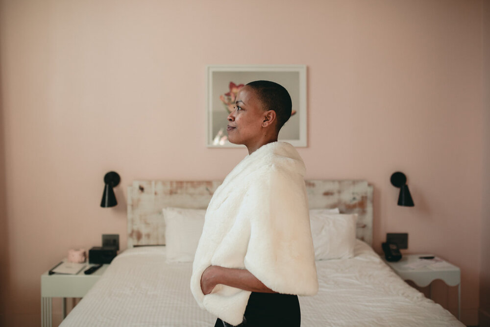 Black bride with fur at Quirk Hotel RVA feminist wedding photography Carly Romeo &amp; CO
