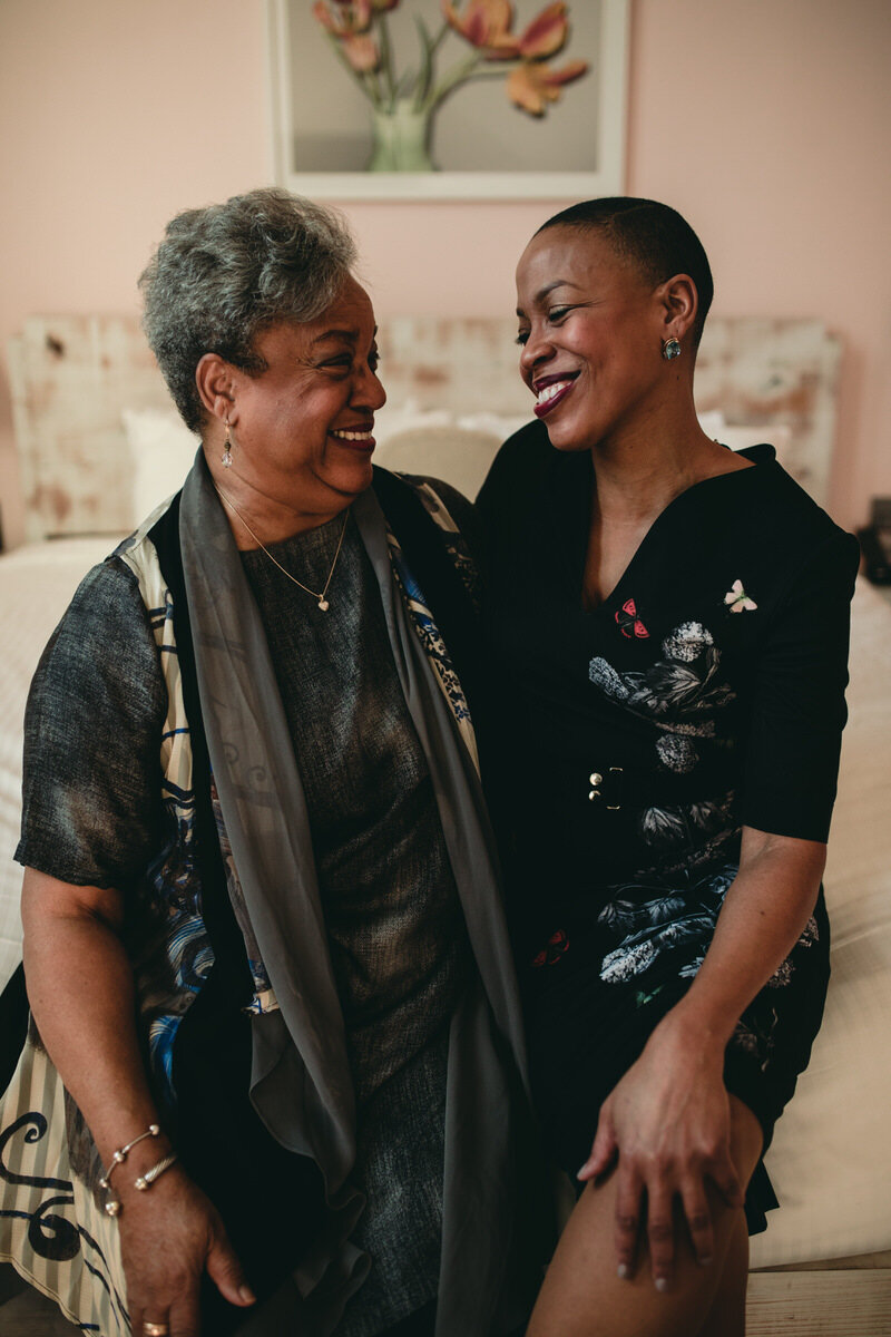 Mother and daughter smiling before wedding at Quirk Hotel Richmond Virginia Carly Romeo Photography