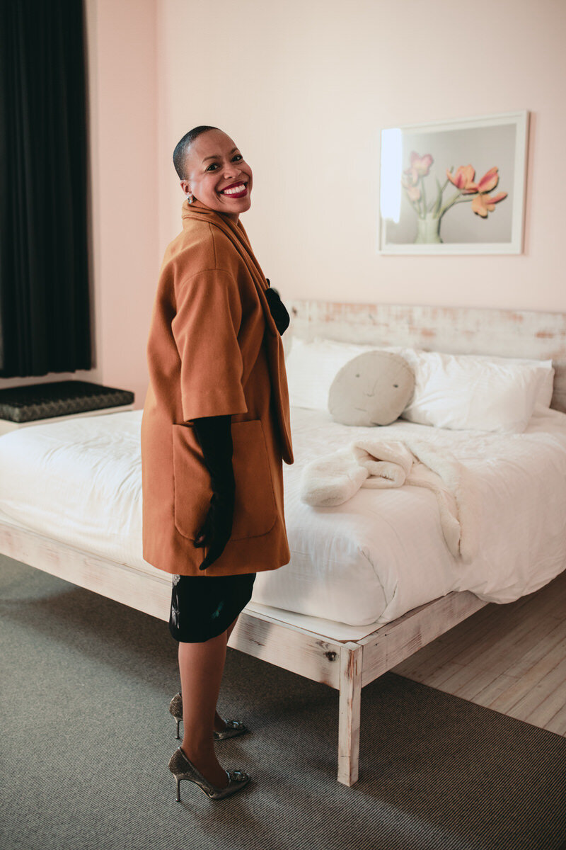 Black woman smiling at the Quirk Hotel Richmond VA Wedding Photographer Carly Romeo