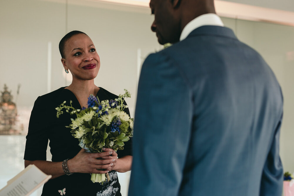 Bride smiling during wedding ceremony at Museum of Fine Arts Richmond VA Carly Romeo Photography