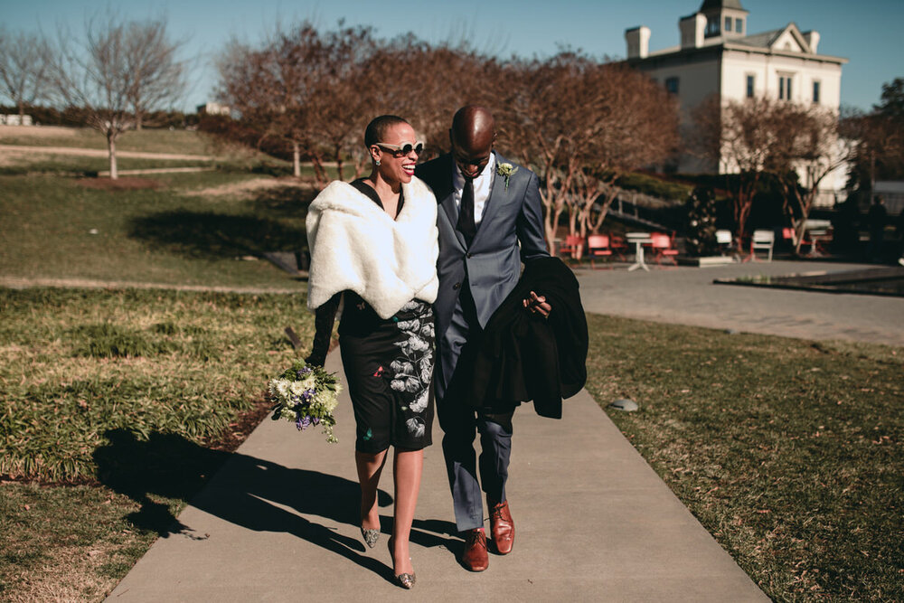  Newlyweds walking in the sun on wedding day outside at the VMFA in Richmond, Virginia, Carly Romeo &amp; Co. 
