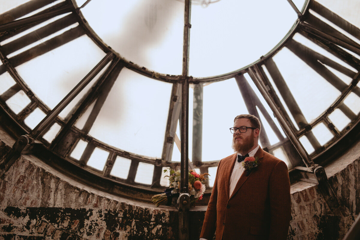 Groom before ceremony inside clocktower at The Bromo Seltzer Arts Tower in Baltimore Carly Romeo
