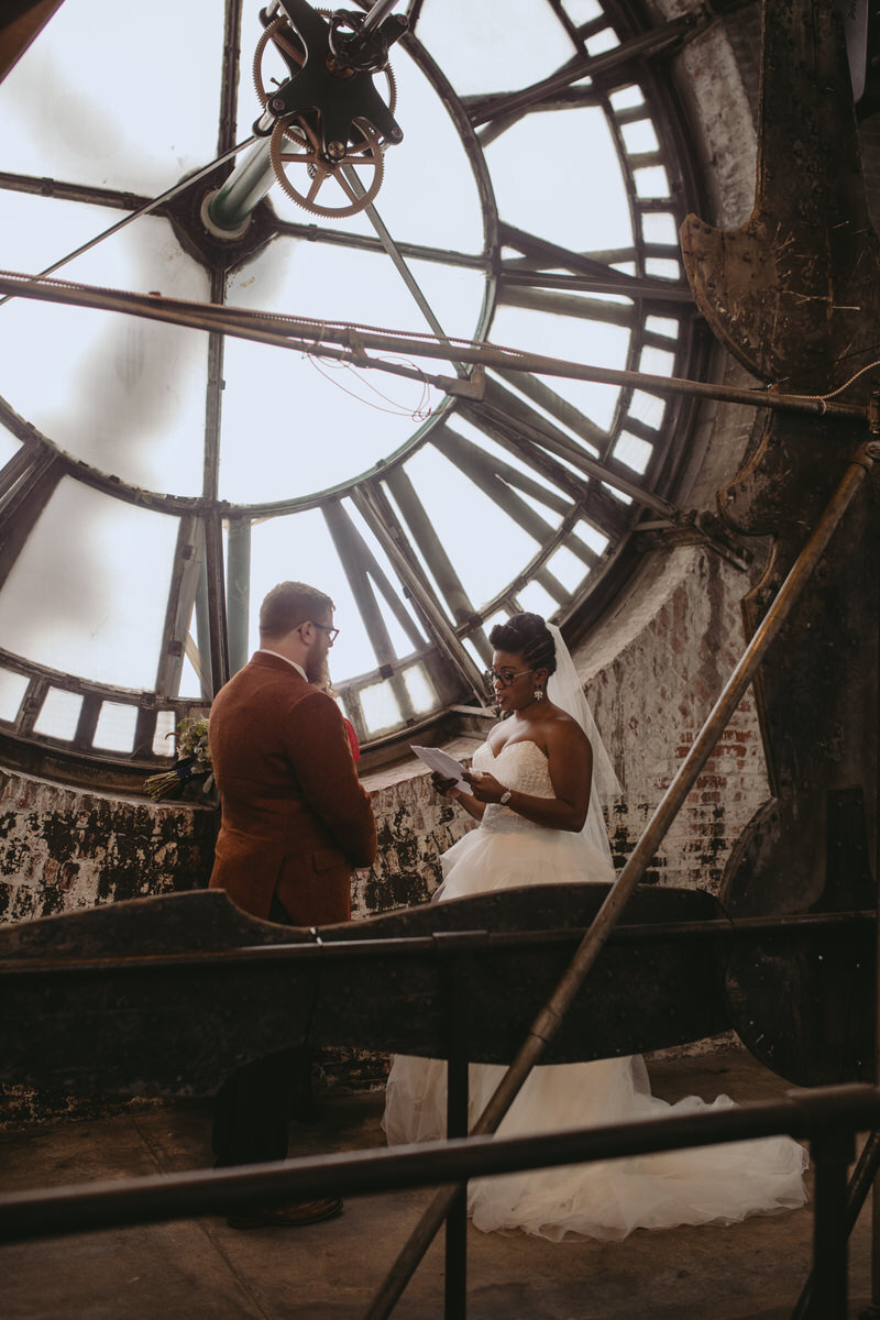 Couple reading vows at Wedding at The Bromo Seltzer Arts Tower Baltimore MD Carly Romeo &amp; Co.