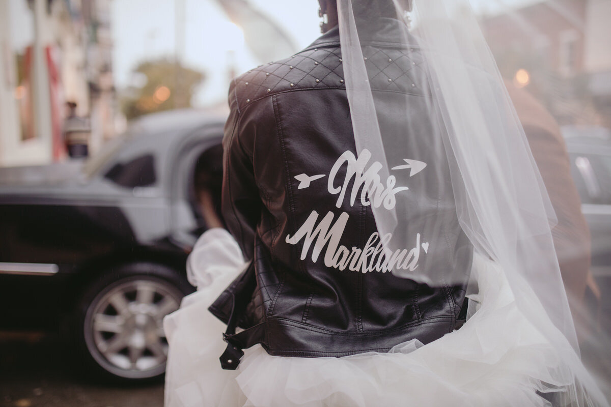 Newly wed bride in leather jacket in Baltimore Maryland Carly Romeo &amp; Co.